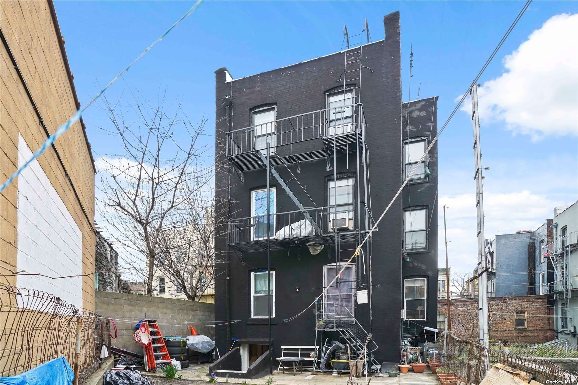 18-11 Centre Street Queens, NY 11385 - Photo 23 of 27 a front view of a building with blue lights