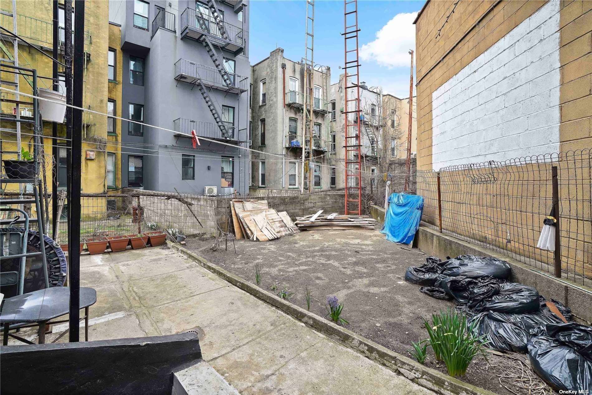 18-11 Centre Street Queens, NY 11385 - Photo 25 of 27 a view of a street with tall buildings