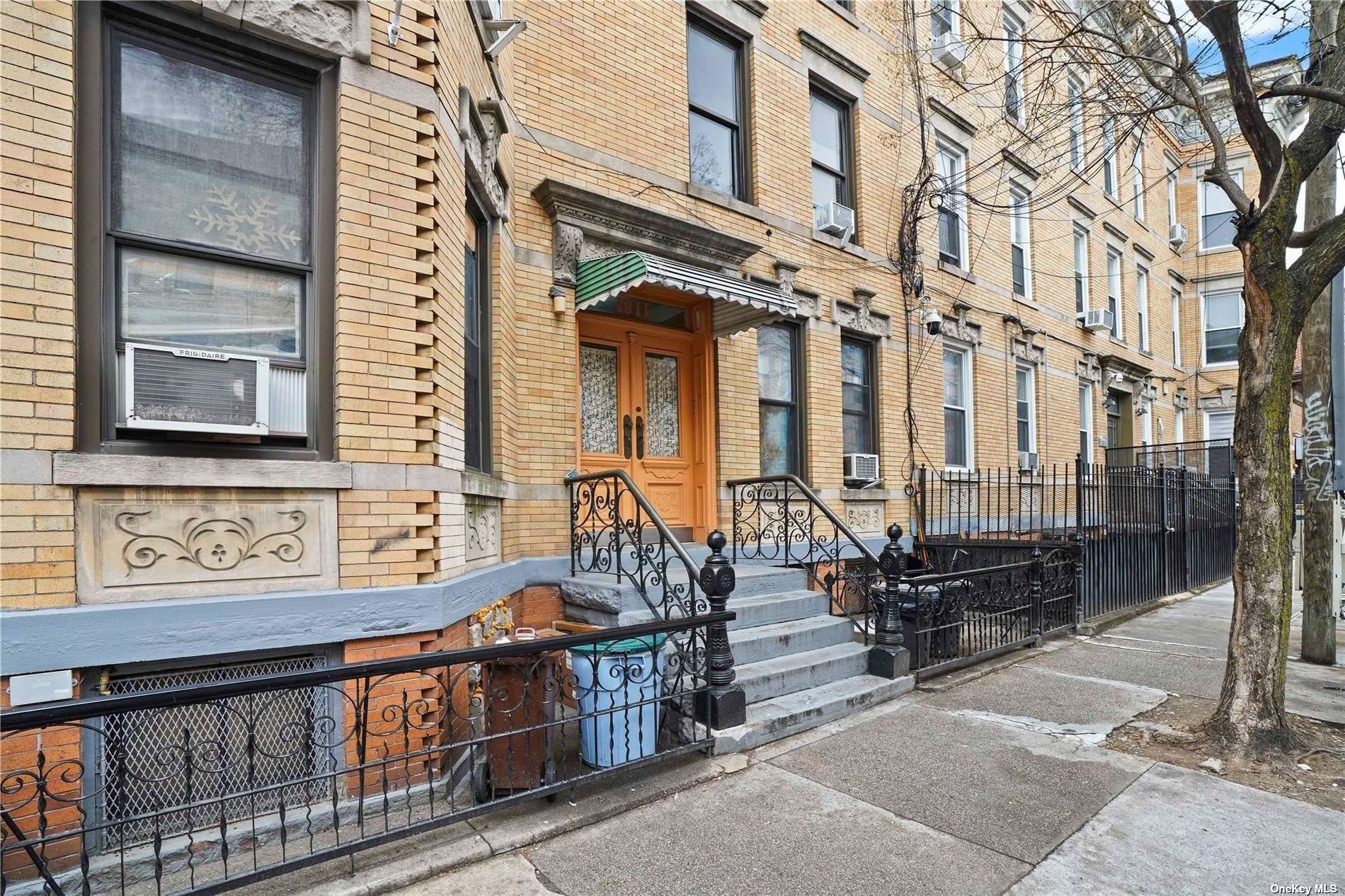 18-11 Centre Street Queens, NY 11385 - Photo 3 of 27 a view of a brick house with large windows