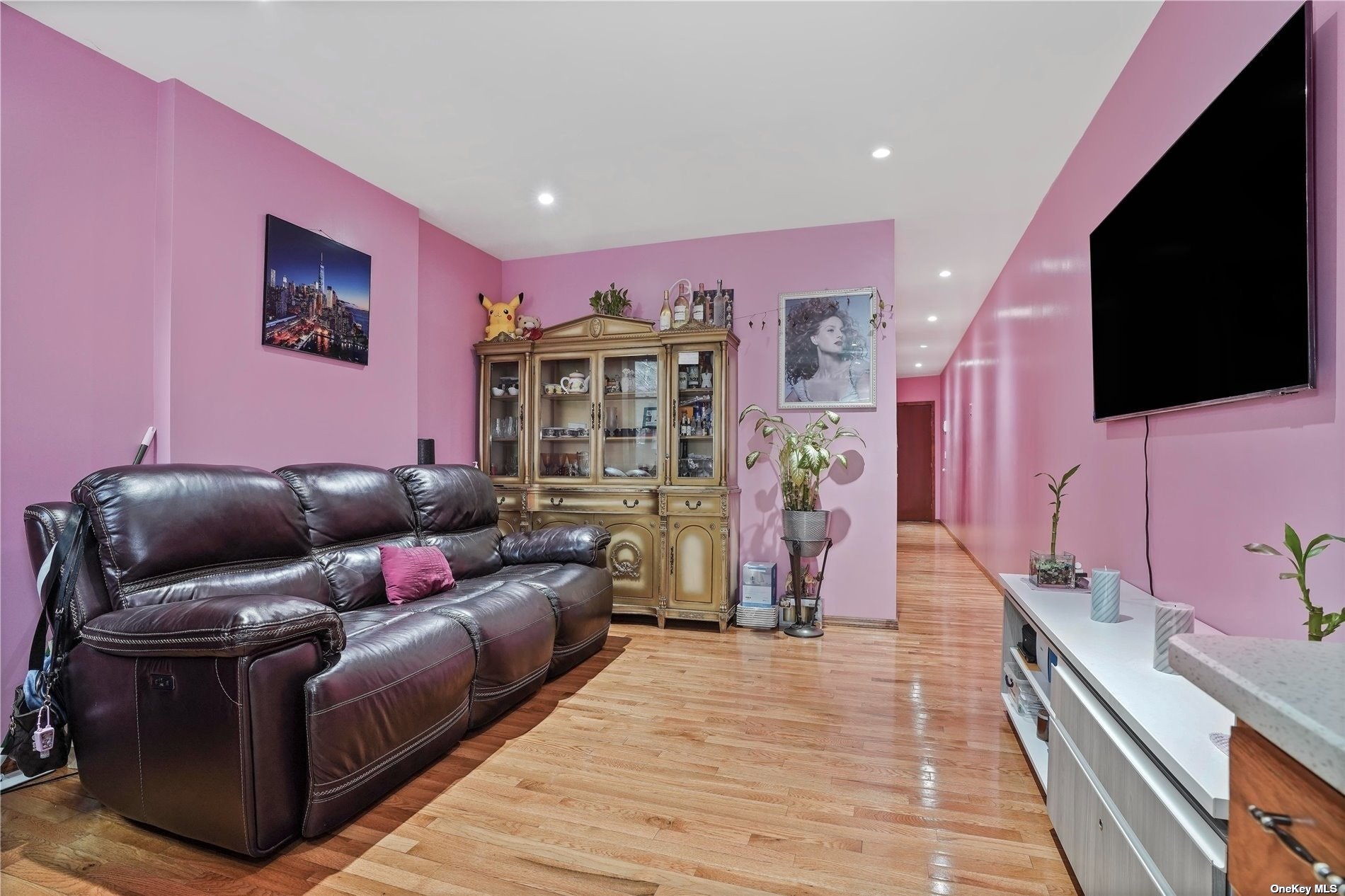 18-11 Centre Street Queens, NY 11385 - Photo 7 of 27 a living room with furniture and a flat screen tv