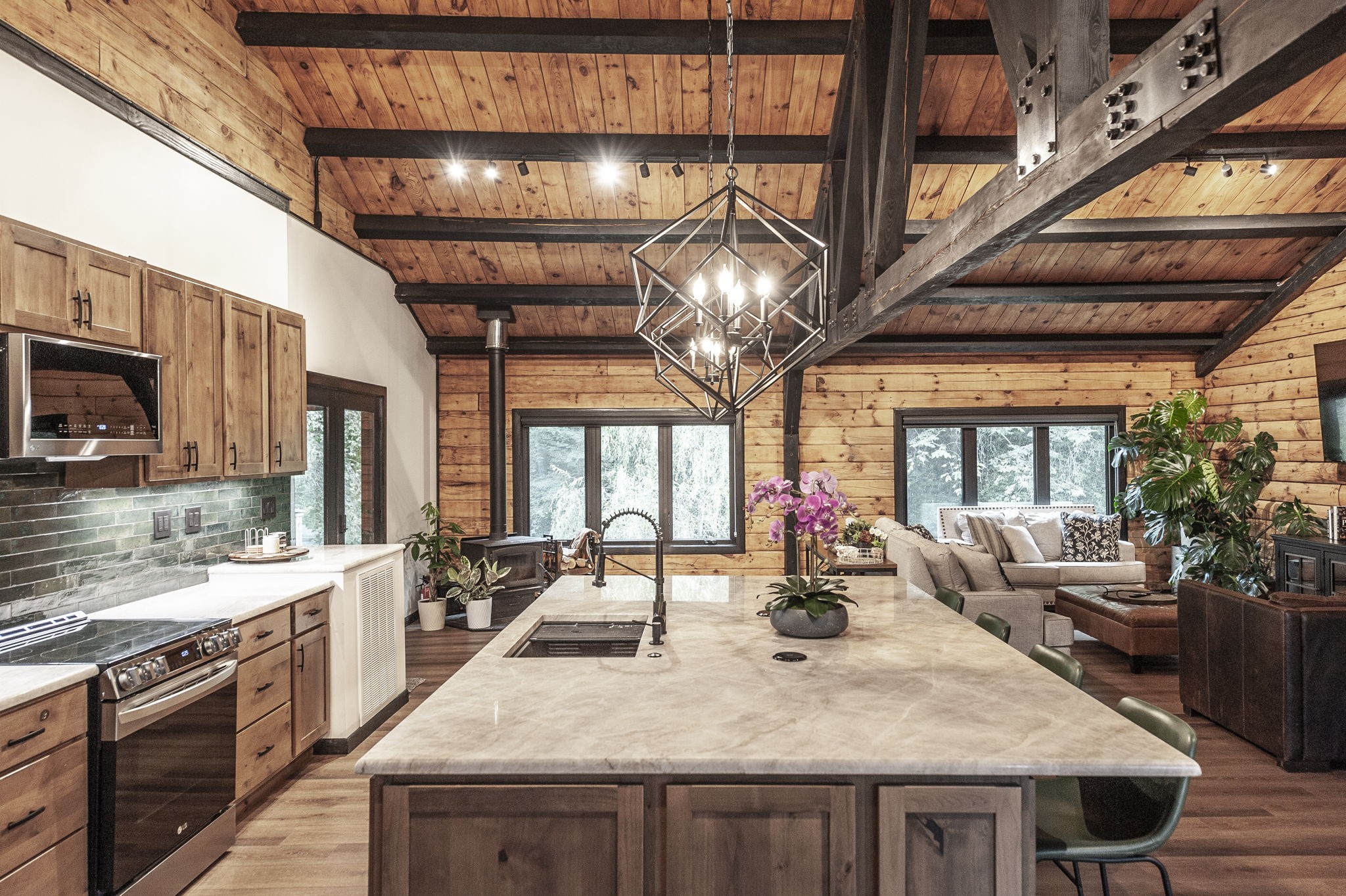 a large kitchen with a table and chairs