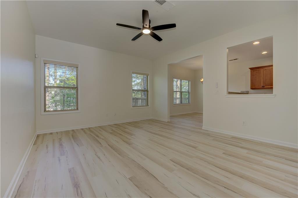 605 Summit Point Canton, GA 30114 - Photo 9 of 56 wooden floor in an empty room with a window