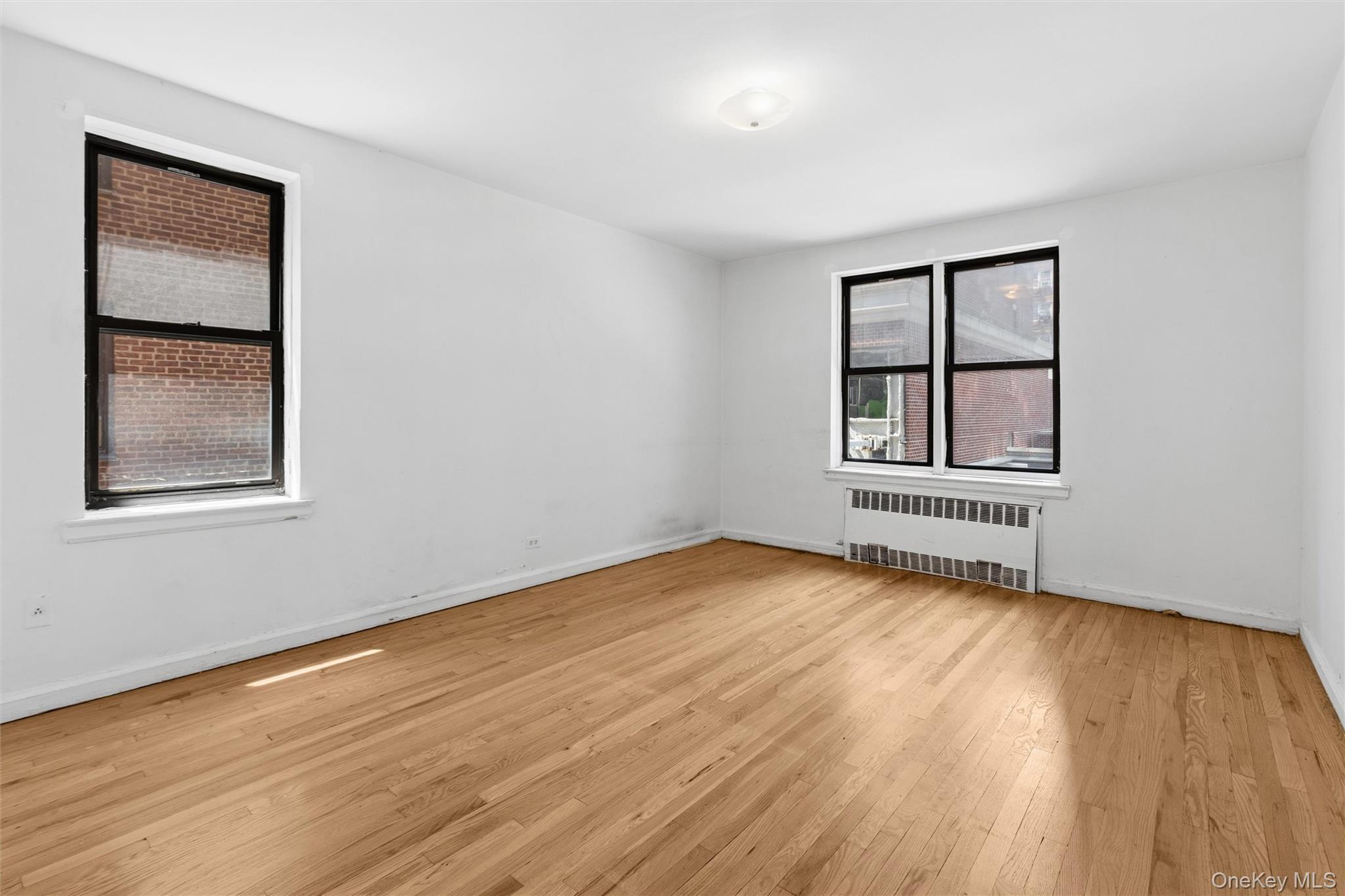 123-35 82nd Road, Unit 3N Queens, NY 11415 - Photo 6 of 10 King sized primary bedroom with double closets