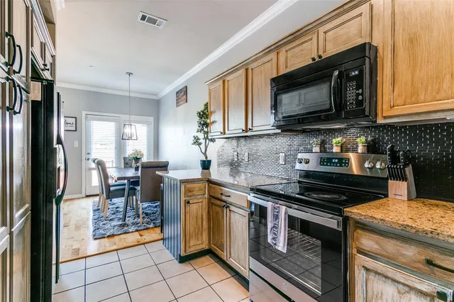 a view of a brick building with a bench in front of building