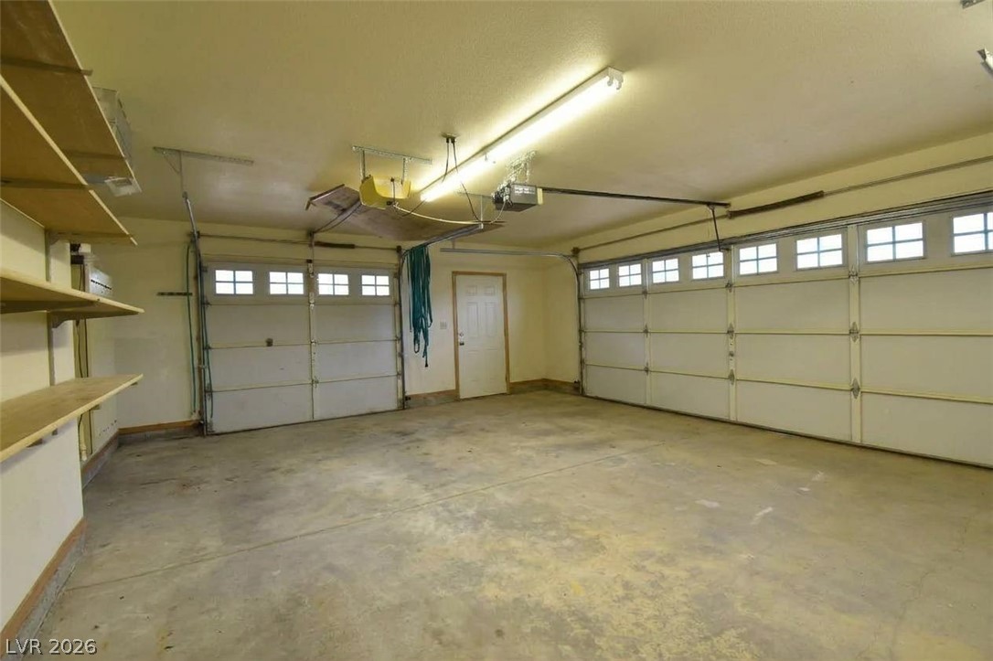 1129 East Ponderosa Road Hatch, UT 84735 - Photo 47 of 47 Concrete floors and built-in shelving define this highly functional multi-car storage space.