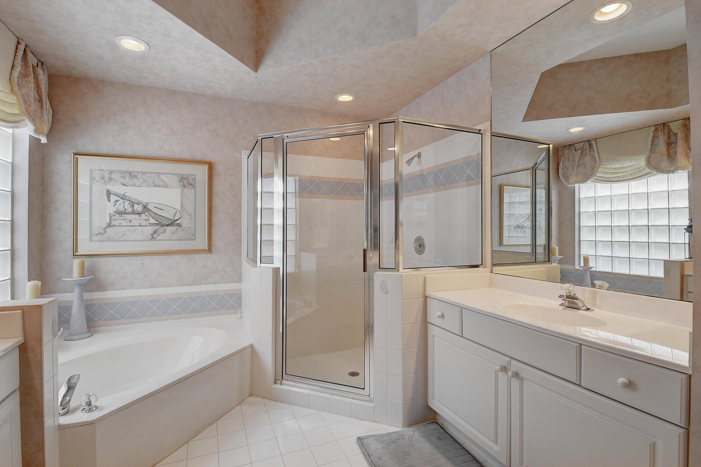 7725 Rockford Road Boynton Beach, FL 33472 - Photo 16 of 47 a bathroom with a double vanity sink mirror double and bathtub