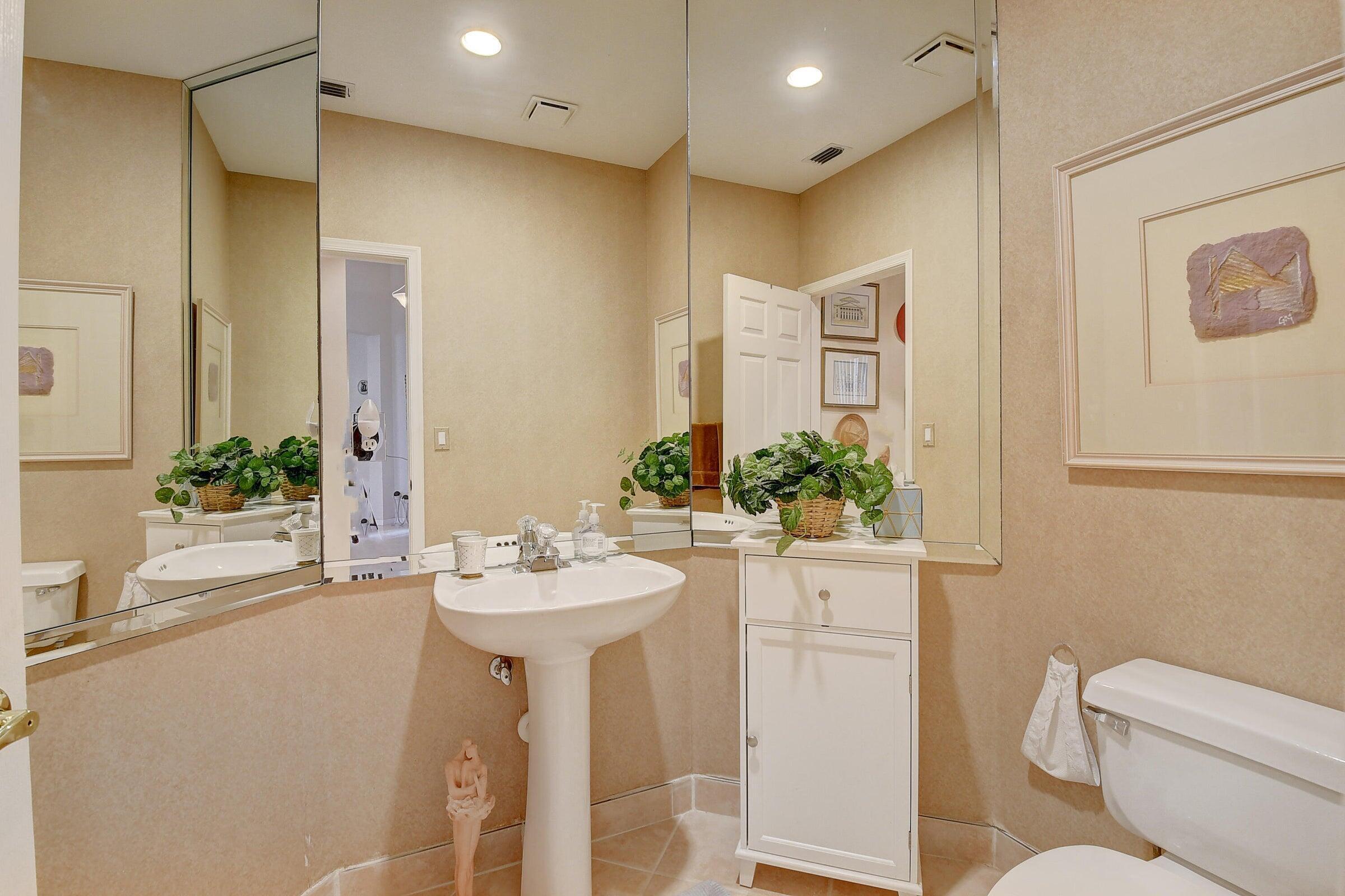 7725 Rockford Road Boynton Beach, FL 33472 - Photo 20 of 47 a bathroom with a sink toilet and shower