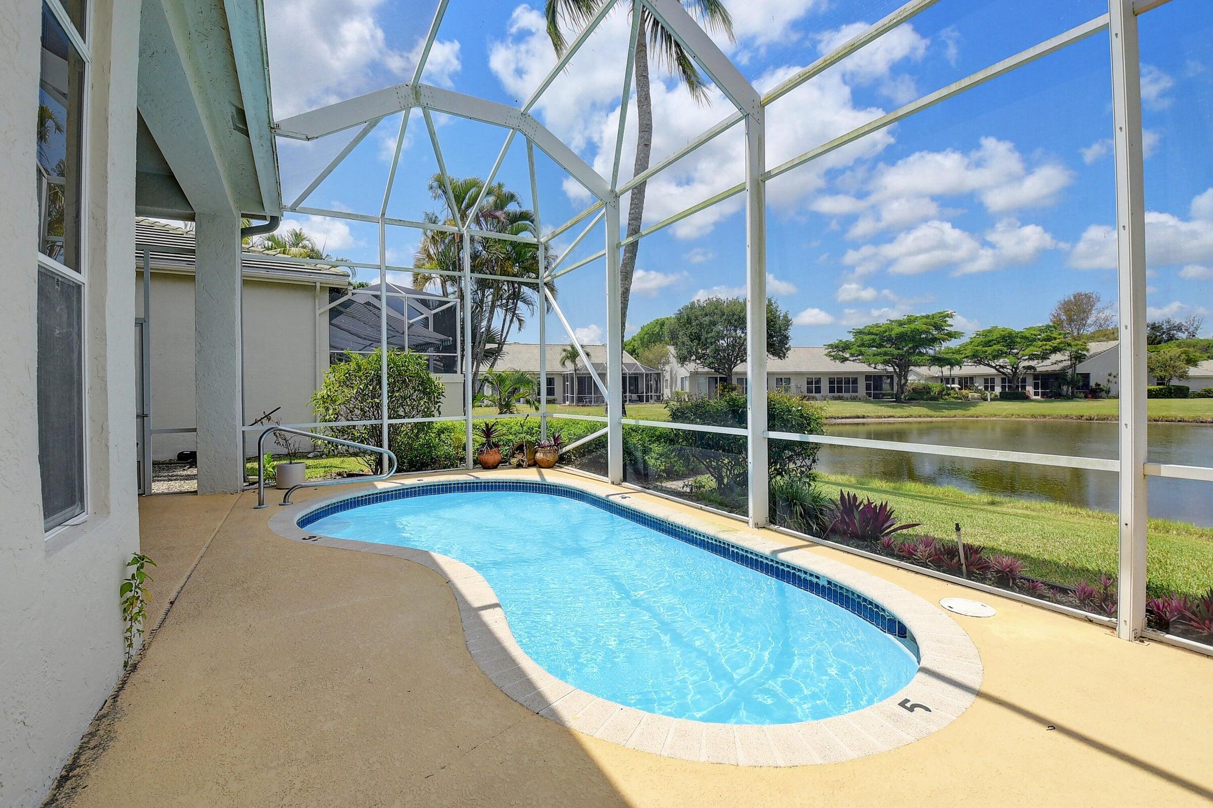 7725 Rockford Road Boynton Beach, FL 33472 - Photo 22 of 47 a view of swimming pool with chairs