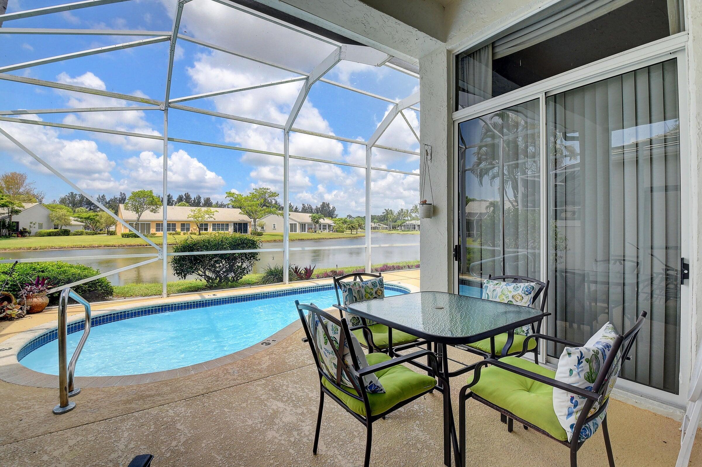 7725 Rockford Road Boynton Beach, FL 33472 - Photo 23 of 47 a dining area with furniture and a table