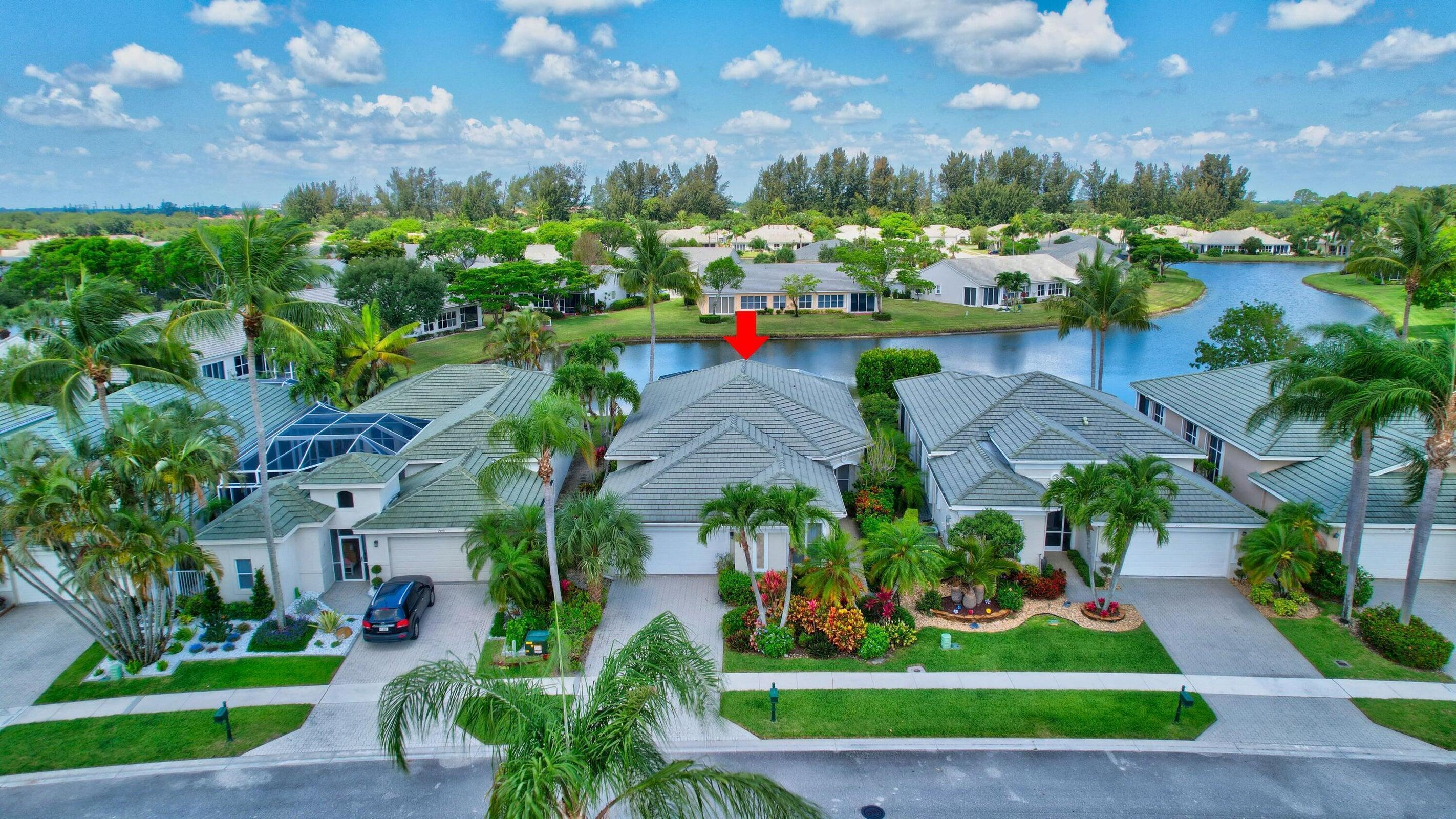 7725 Rockford Road Boynton Beach, FL 33472 - Photo 27 of 47 a view of a yard with plants and large trees