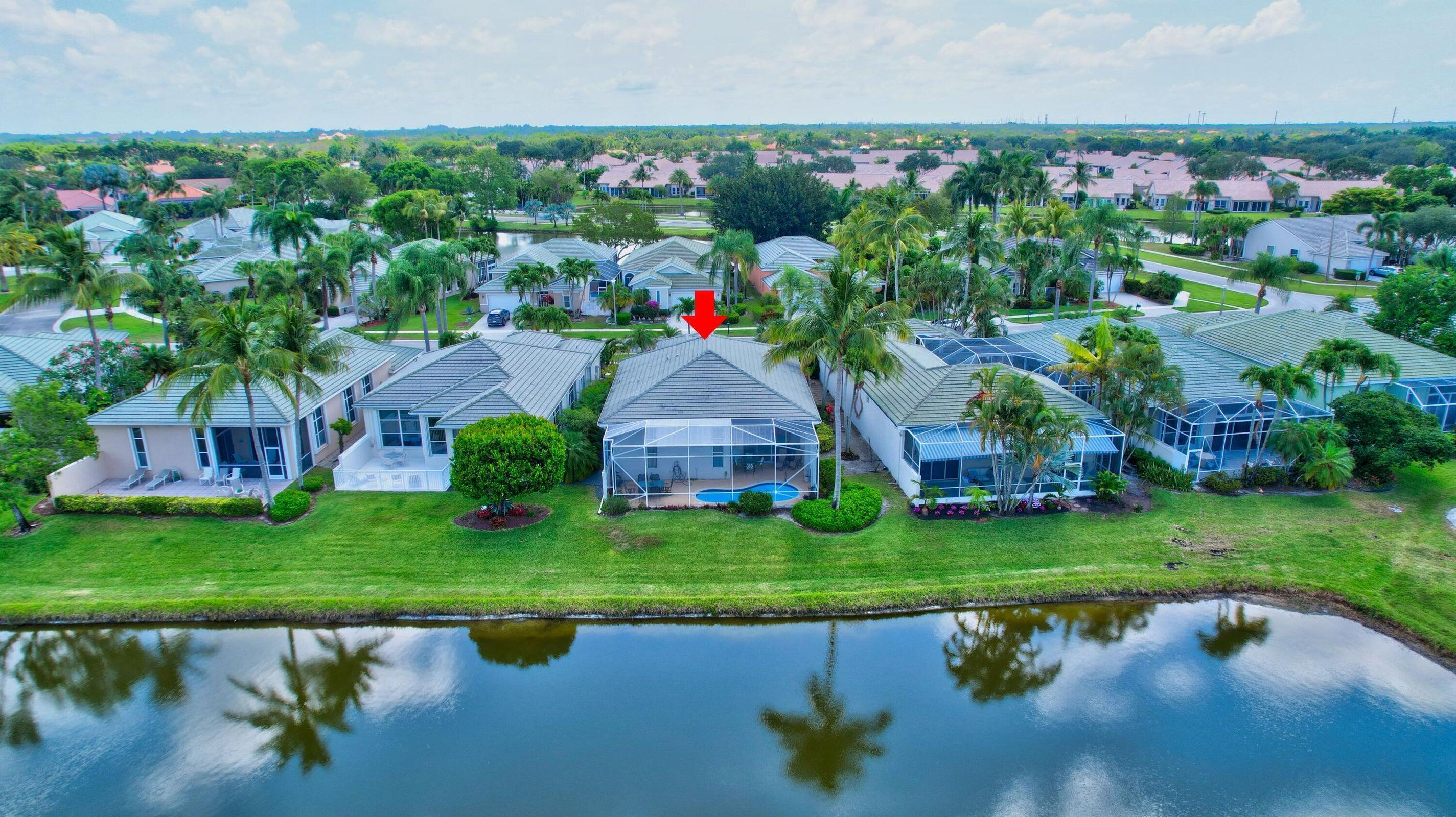 7725 Rockford Road Boynton Beach, FL 33472 - Photo 28 of 47 a aerial view of a house with a garden and lake view