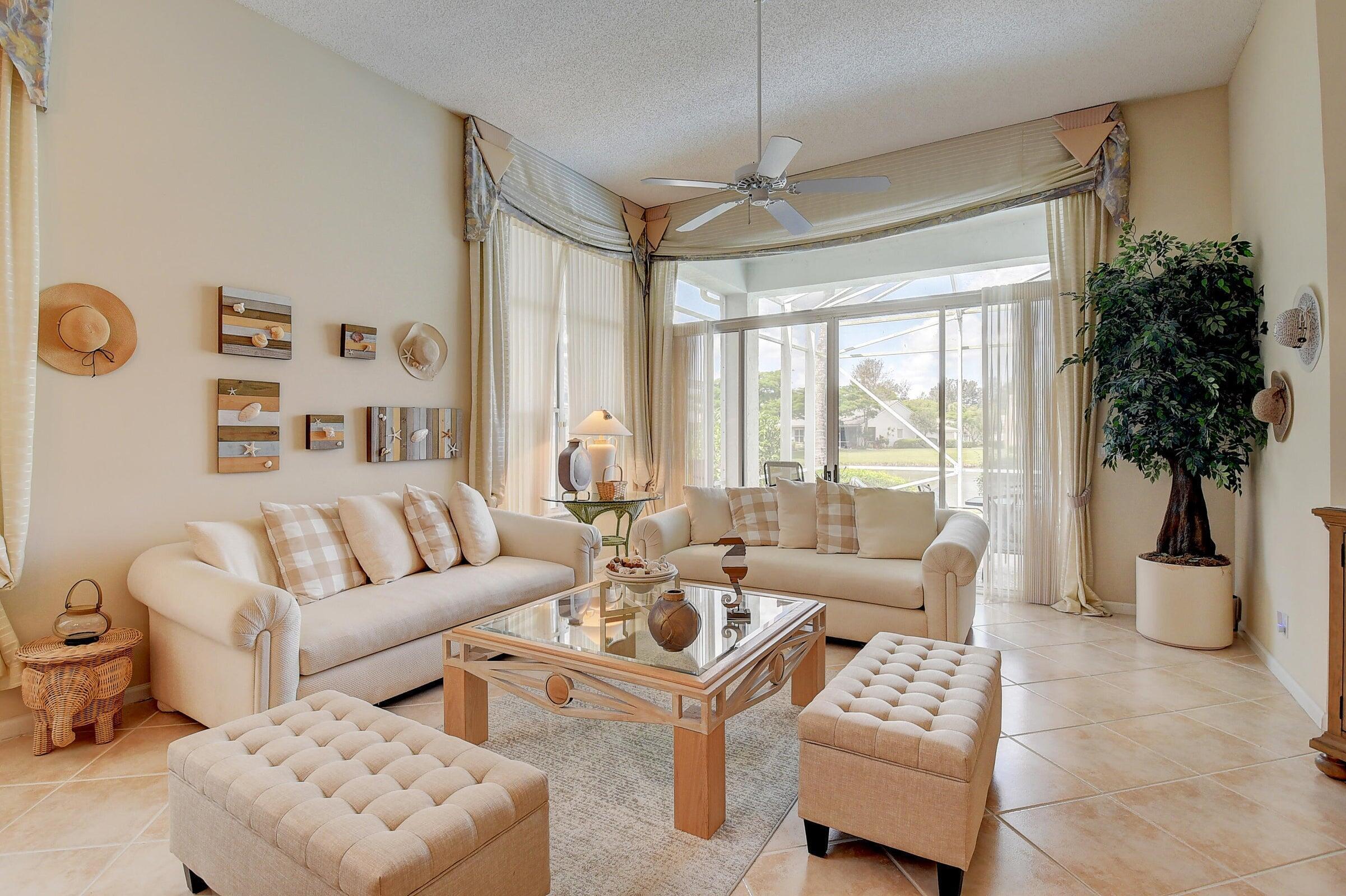 7725 Rockford Road Boynton Beach, FL 33472 - Photo 7 of 47 a living room with furniture and a large window