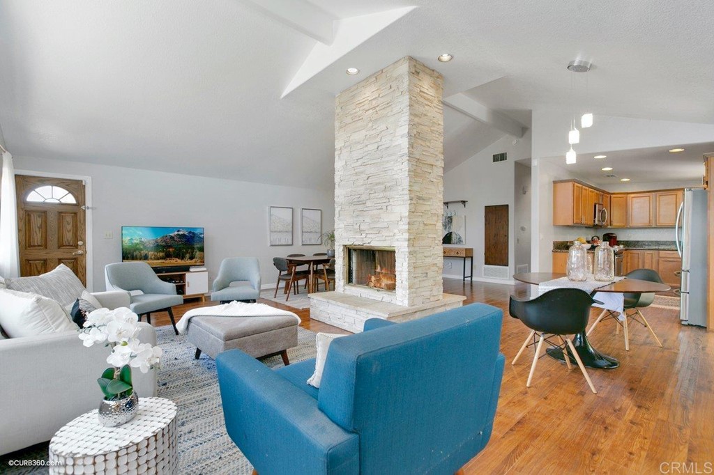 8115 Whitehead Place La Mesa, CA 91942 - Photo 3 of 30 a living room with furniture wooden floor and a fireplace