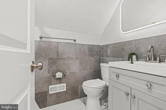 a bathroom with a toilet sink and a shower