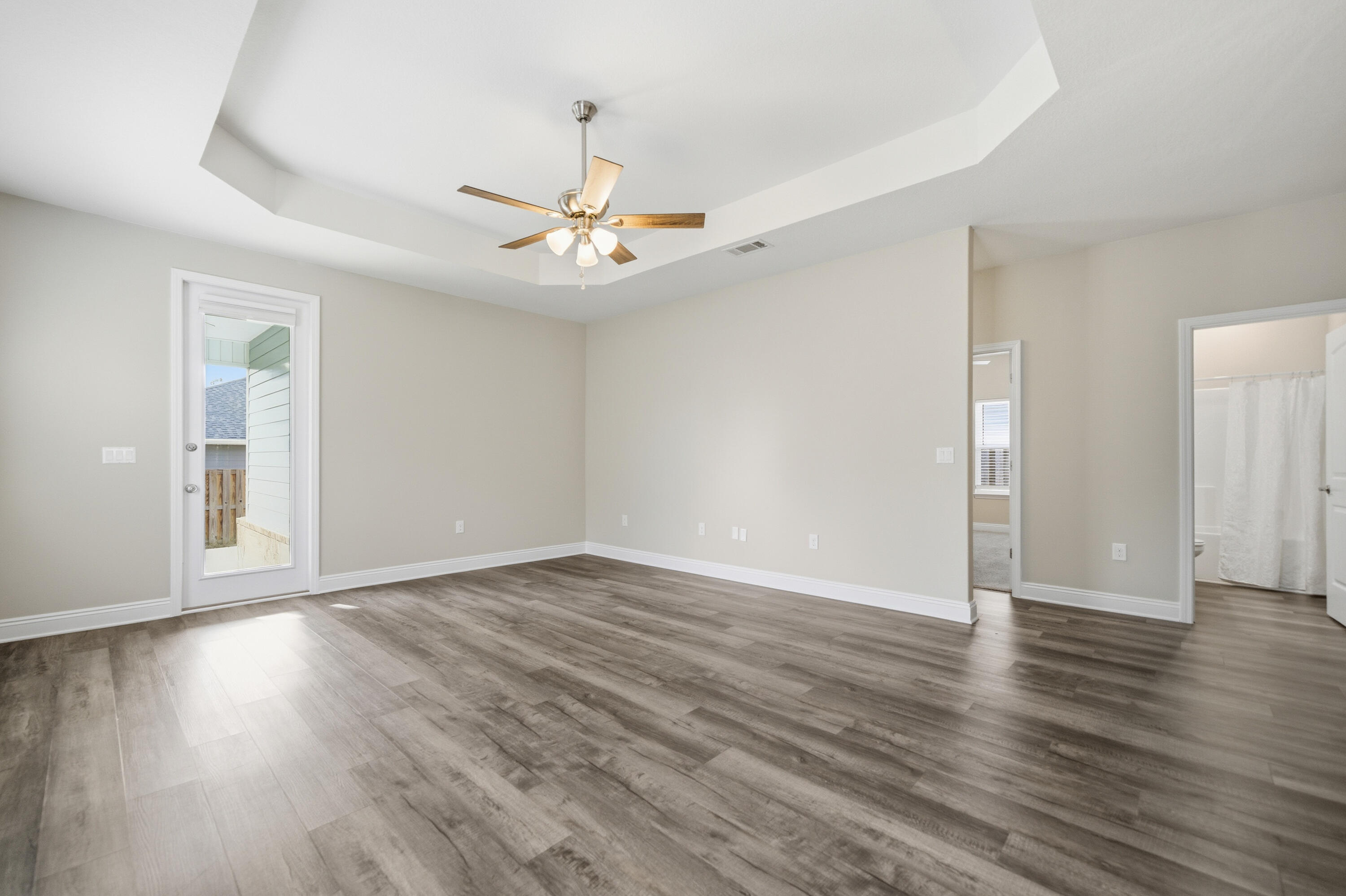 802 Marquis Way Freeport, FL 32439 - Photo 12 of 43 a view of an empty room with wooden floor