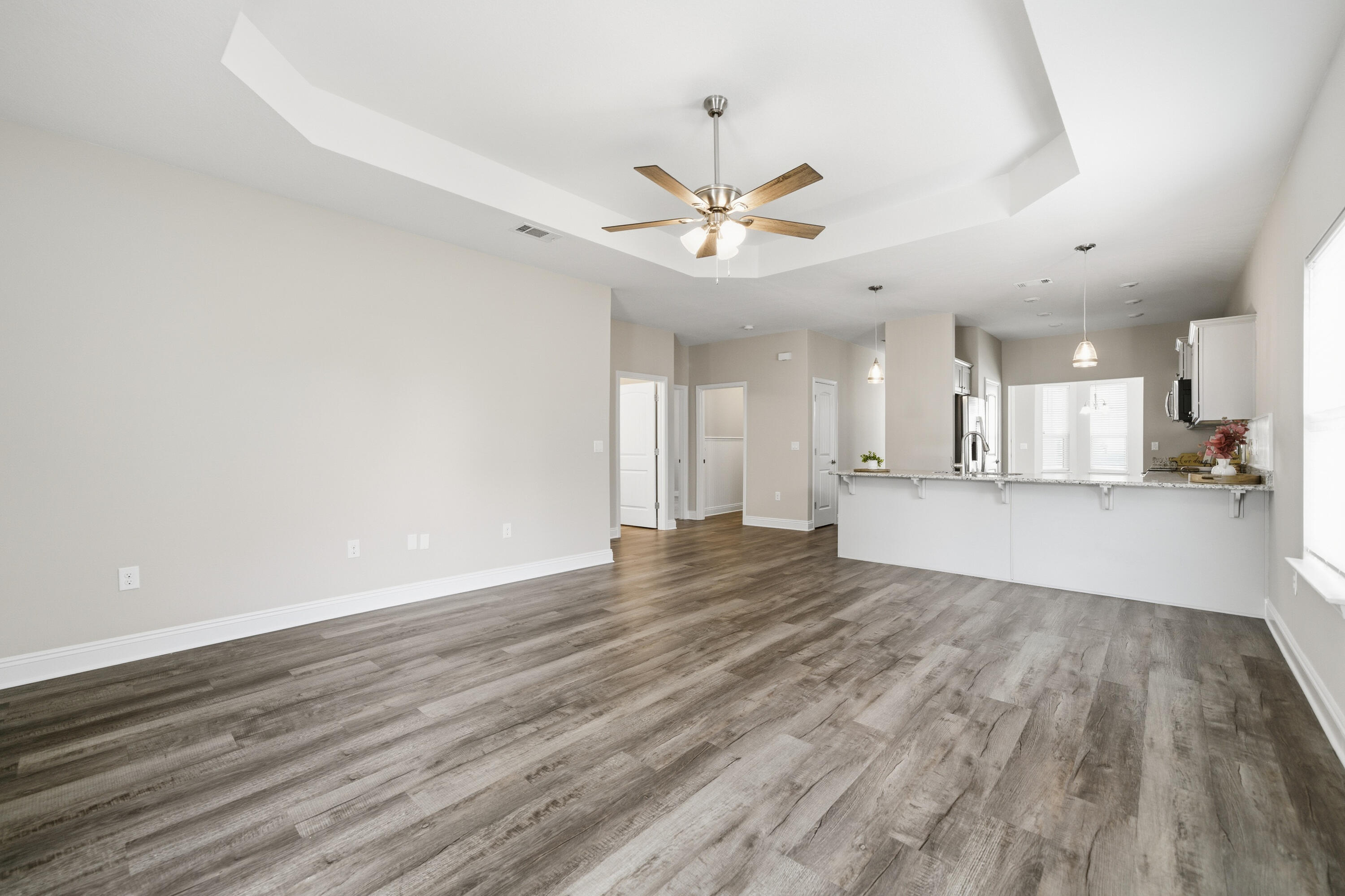802 Marquis Way Freeport, FL 32439 - Photo 13 of 43 a view of an empty room and kitchen view