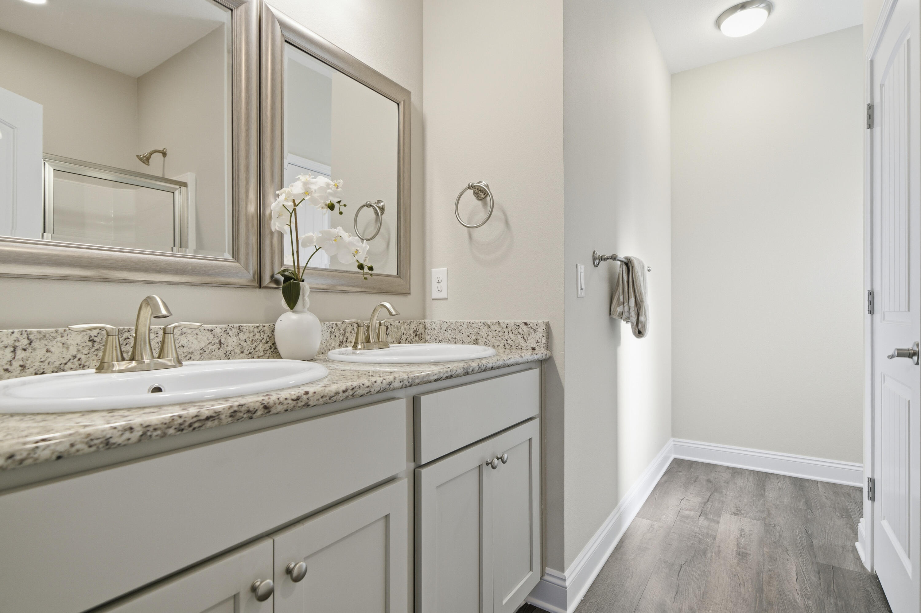 802 Marquis Way Freeport, FL 32439 - Photo 19 of 43 a bathroom with a double vanity sink and mirror