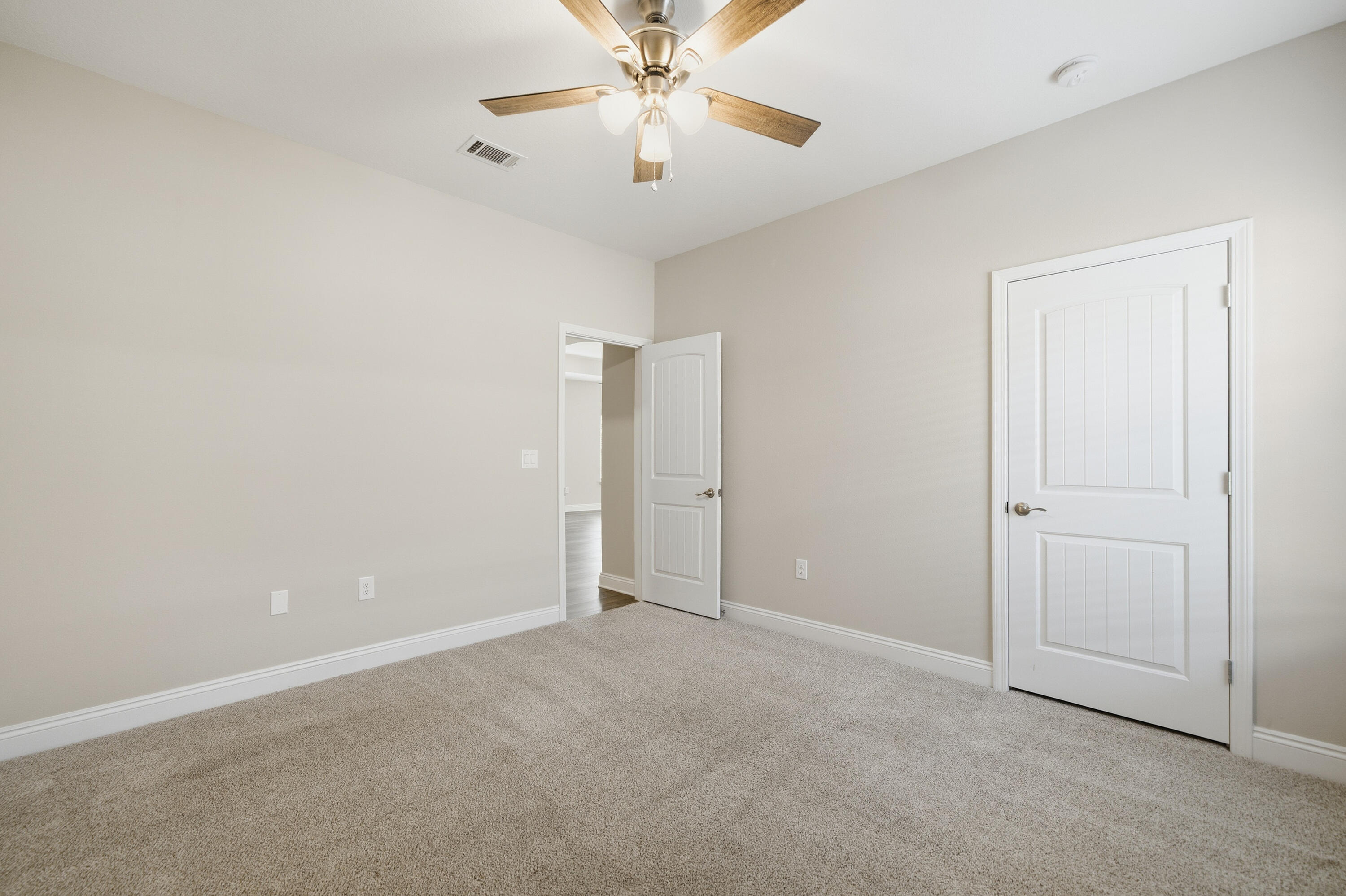 802 Marquis Way Freeport, FL 32439 - Photo 27 of 43 an empty room with closet and a chandelier fan