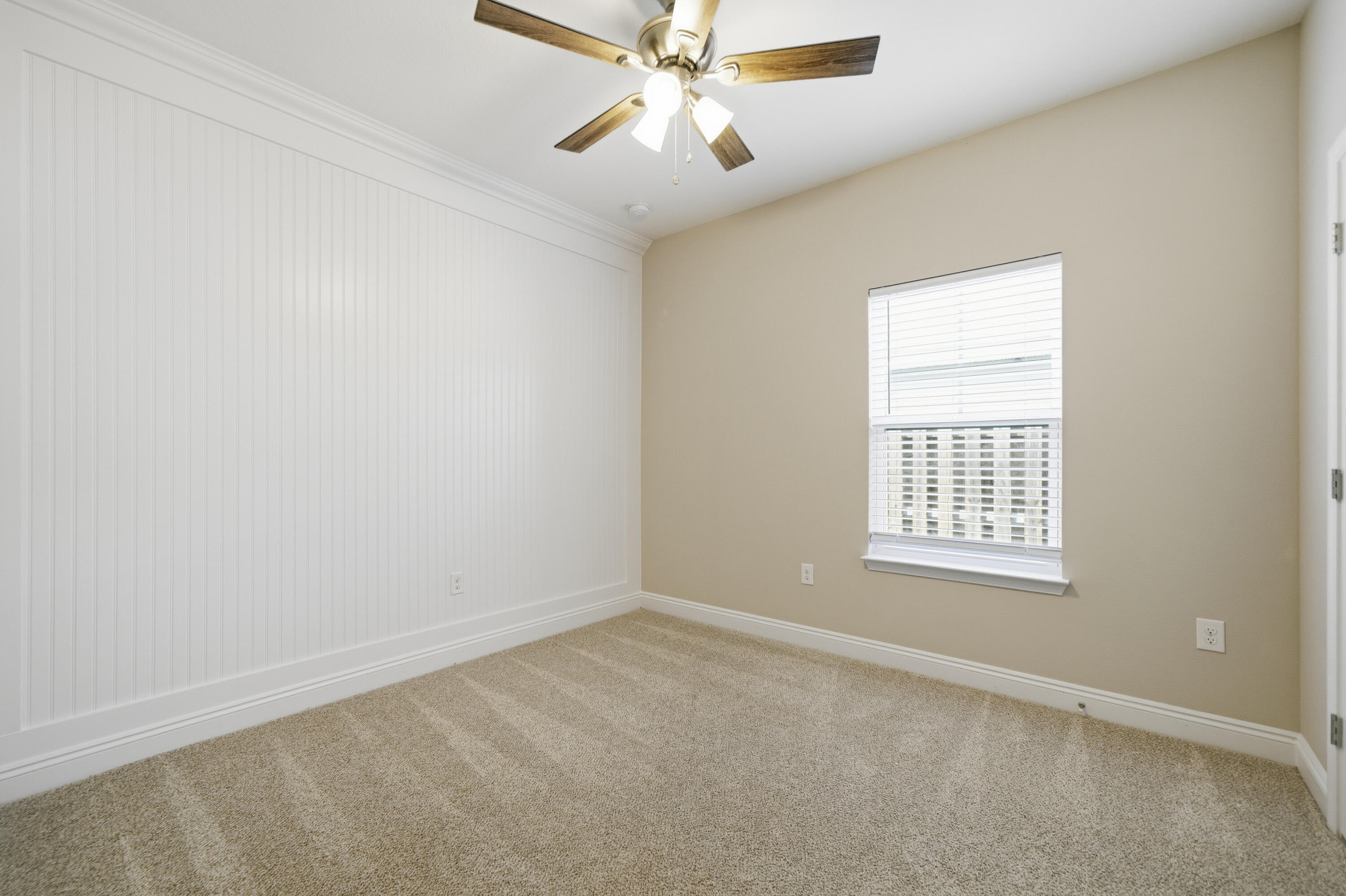 802 Marquis Way Freeport, FL 32439 - Photo 28 of 43 an empty room with a window and a fan
