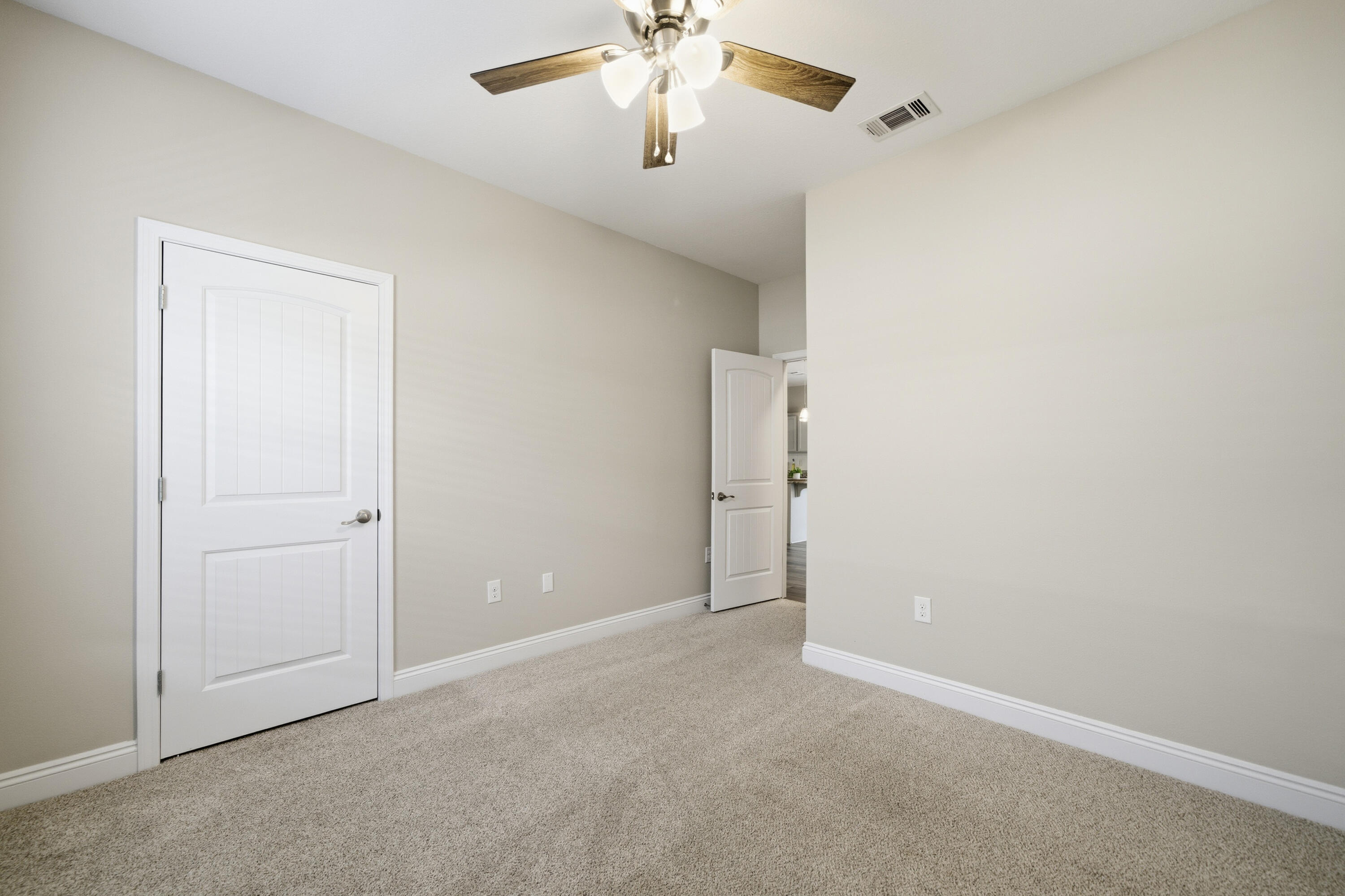 802 Marquis Way Freeport, FL 32439 - Photo 30 of 43 a view of an empty room and a ceiling fan