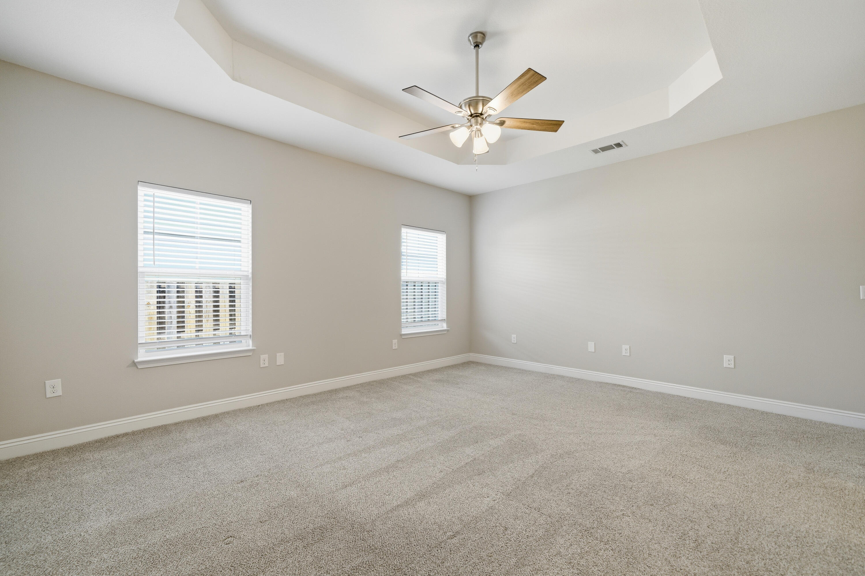 802 Marquis Way Freeport, FL 32439 - Photo 34 of 43 an empty room with windows and fan