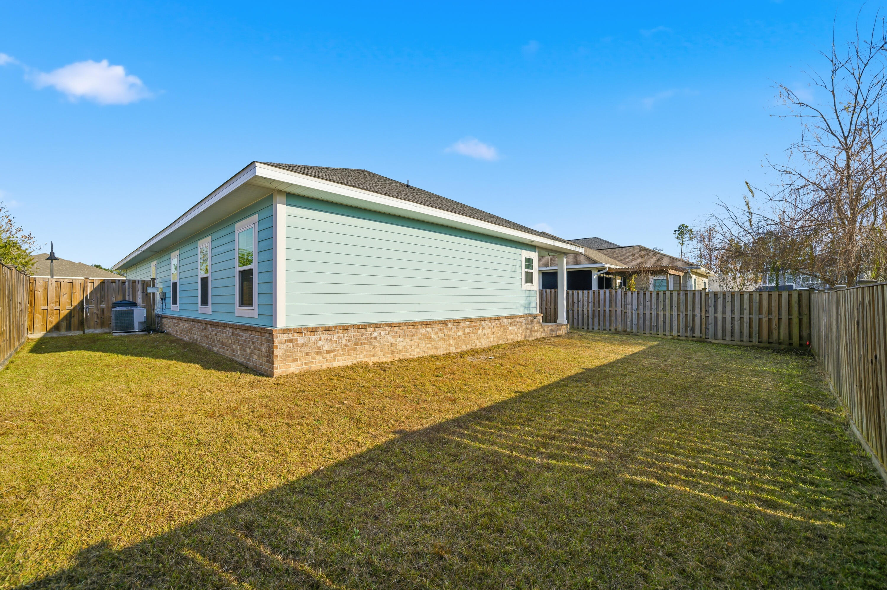 802 Marquis Way Freeport, FL 32439 - Photo 38 of 43 a view of house with backyard and swimming pool