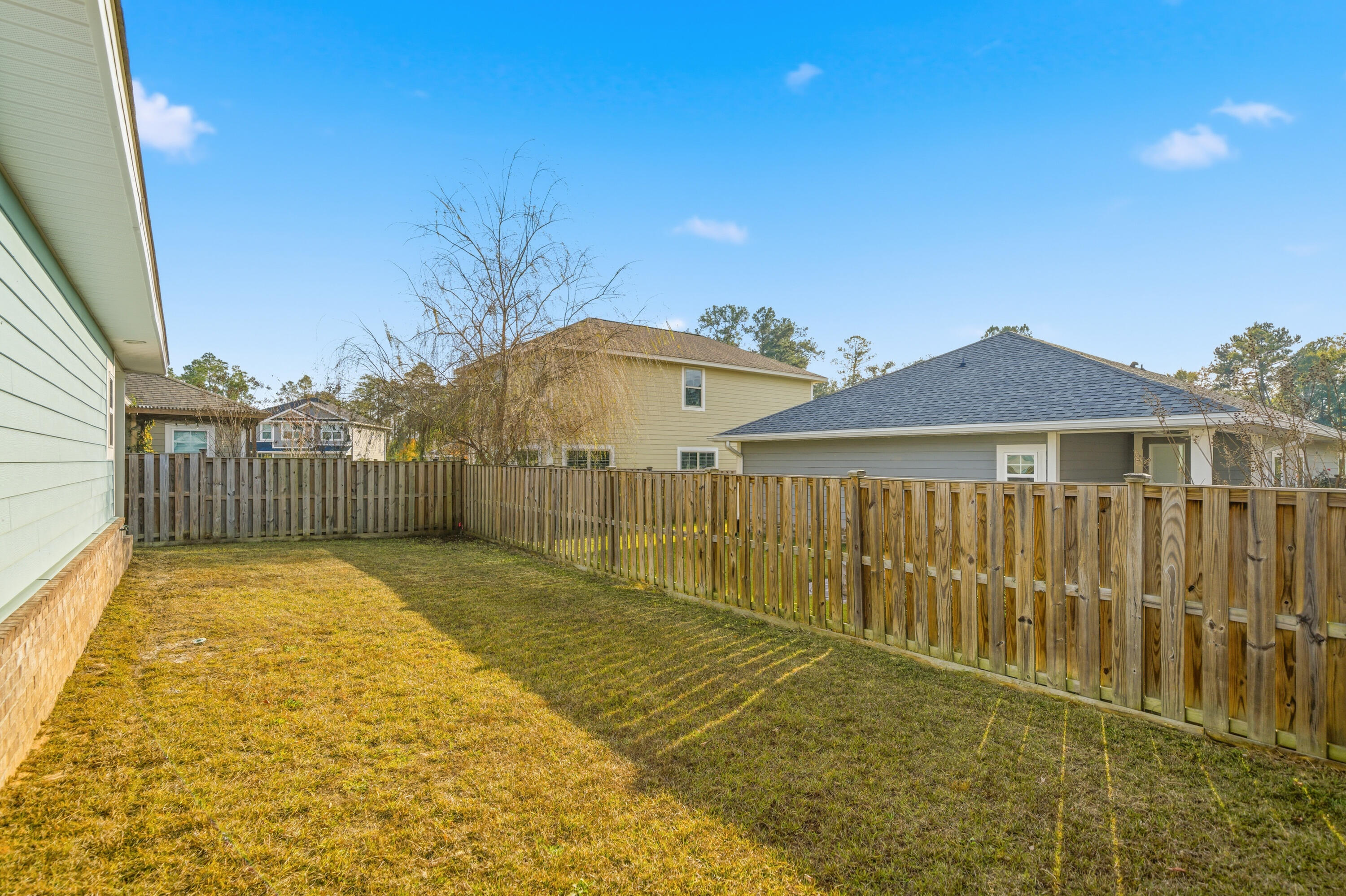 802 Marquis Way Freeport, FL 32439 - Photo 39 of 43 a view of a backyard with a garden