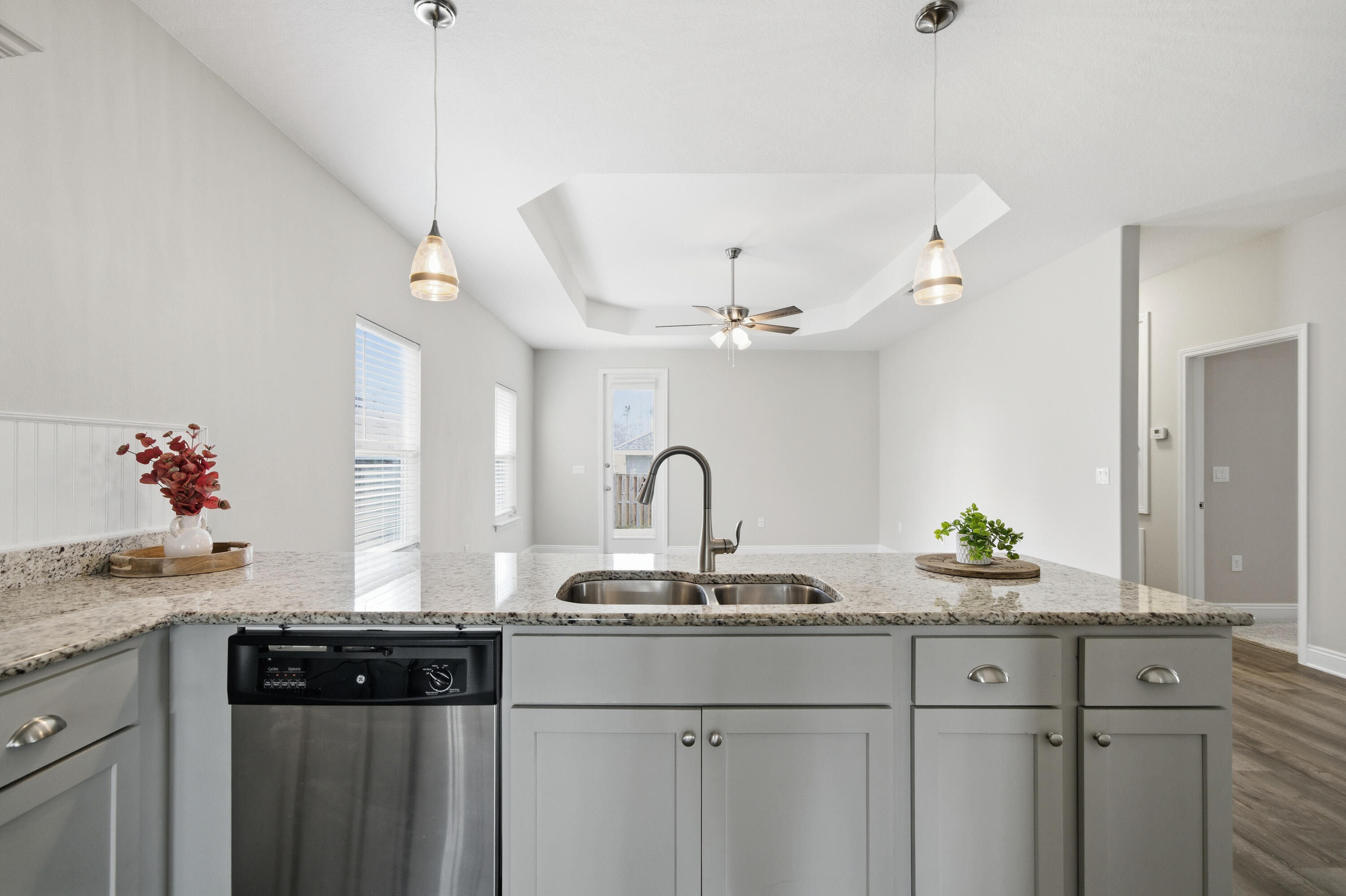 802 Marquis Way Freeport, FL 32439 - Photo 8 of 43 a kitchen with kitchen island granite countertop a sink stainless steel appliances and cabinets