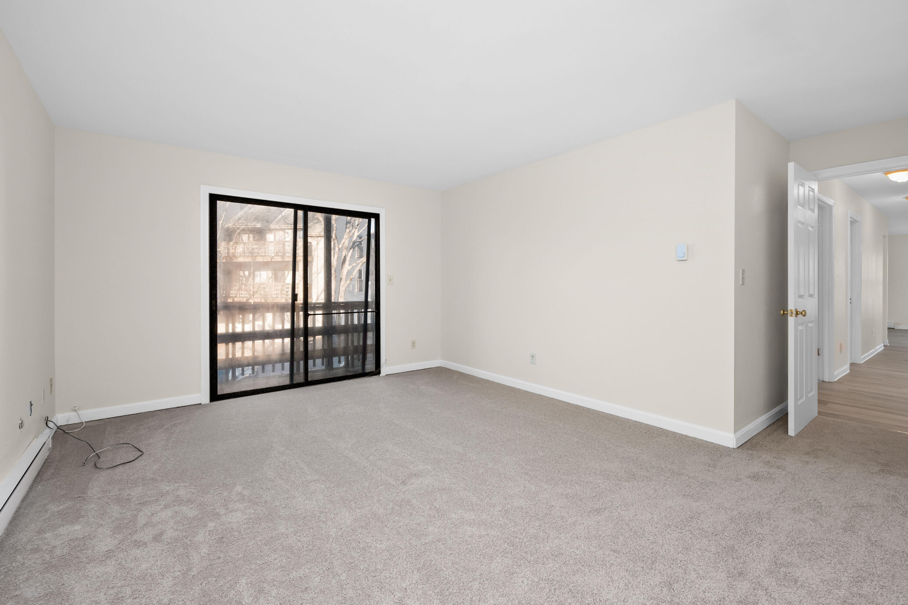 800 Bearses Way, Unit 2NB Hyannis, MA 02601 - Photo 14 of 20 an empty room with windows and closet