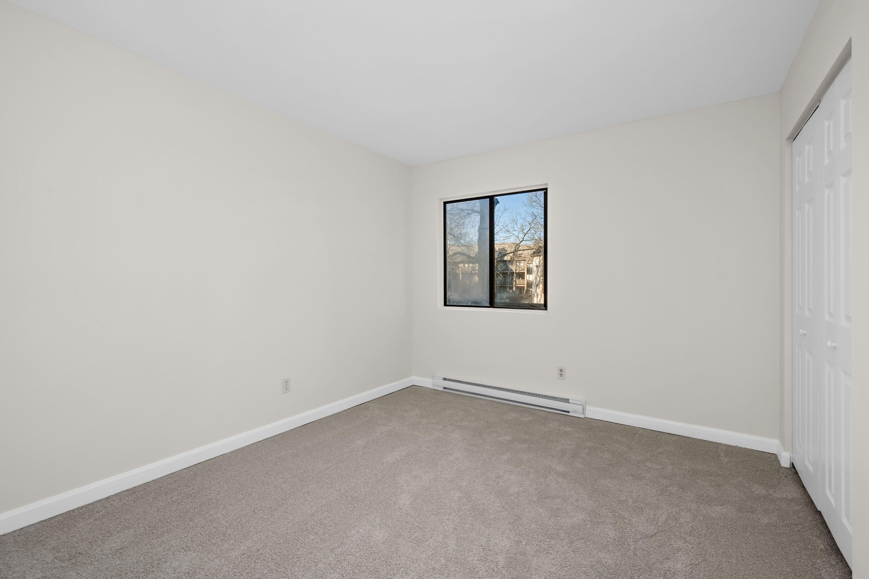 800 Bearses Way, Unit 2NB Hyannis, MA 02601 - Photo 15 of 20 an empty room with a window