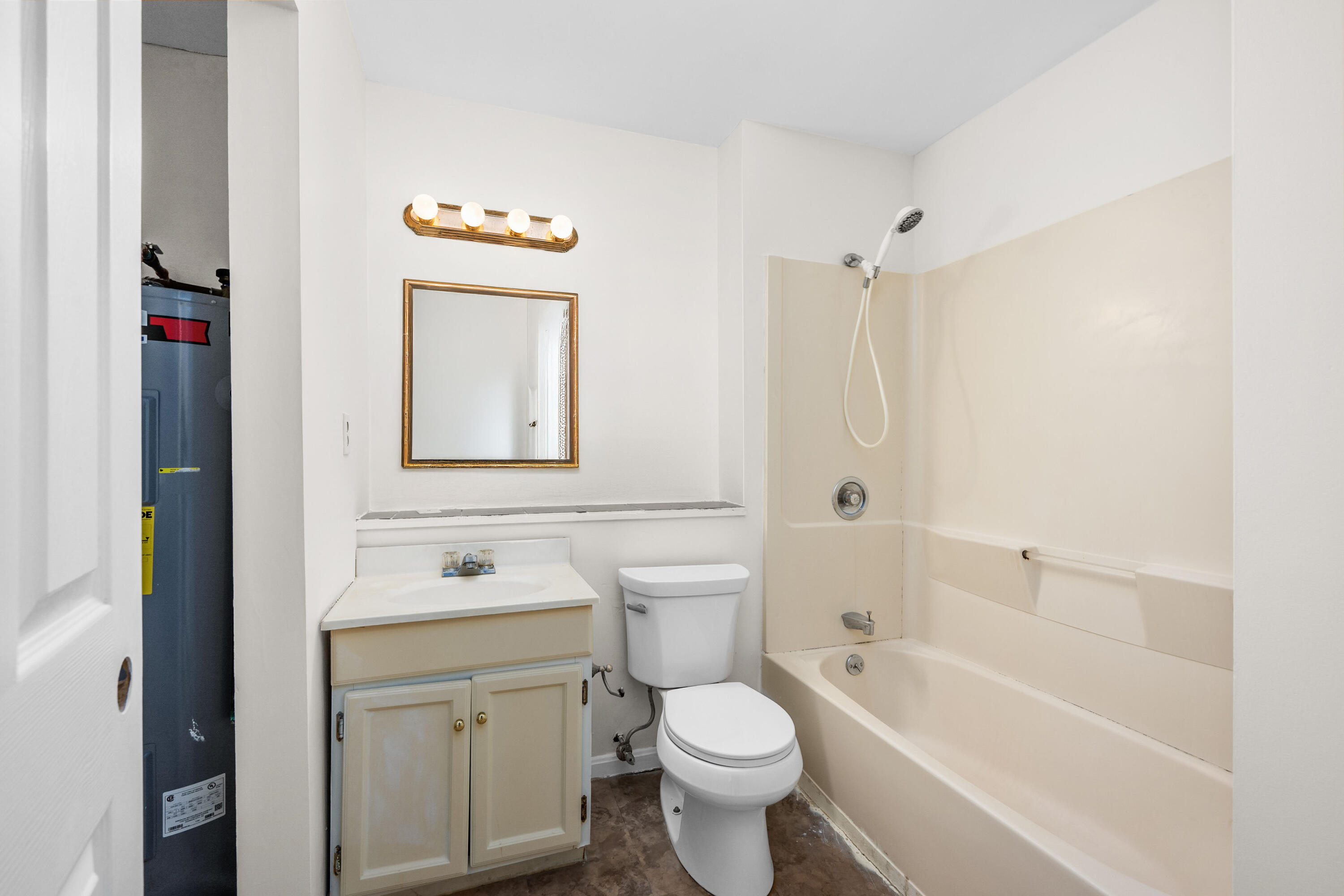 800 Bearses Way, Unit 2NB Hyannis, MA 02601 - Photo 18 of 20 a bathroom with a toilet sink vanity tub and shower