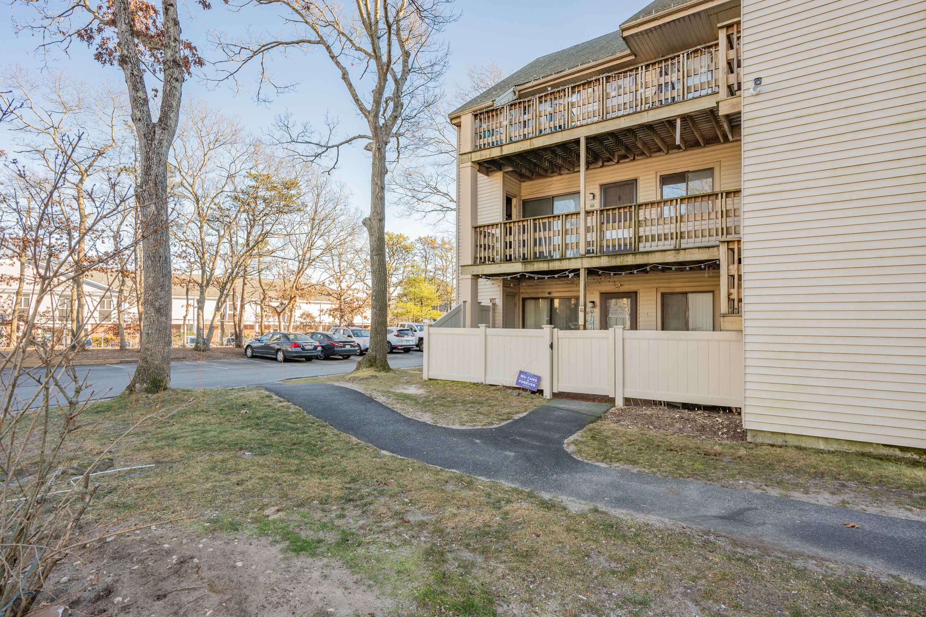 800 Bearses Way, Unit 2NB Hyannis, MA 02601 - Photo 2 of 20 a view of a large building with a large tree