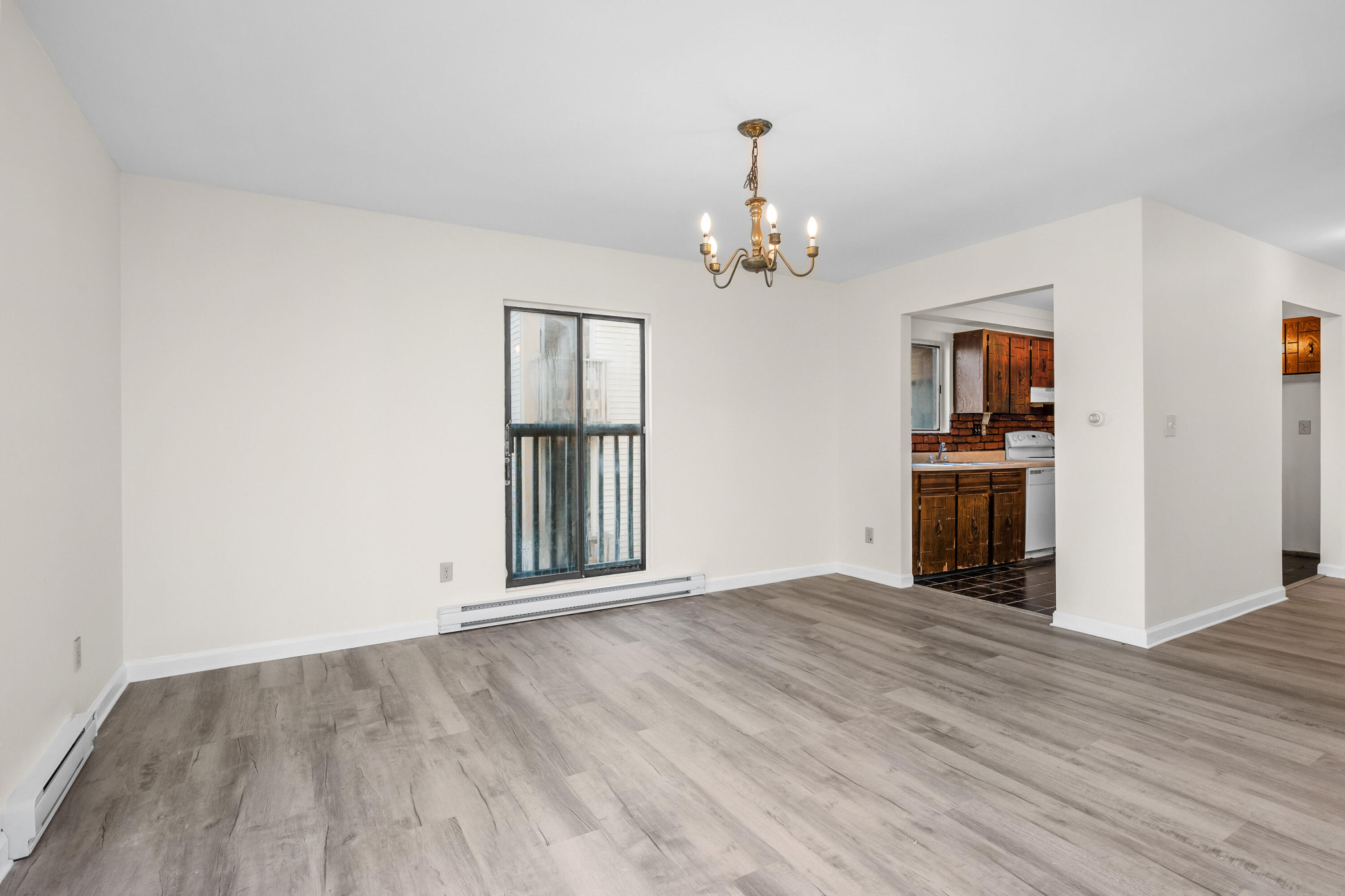800 Bearses Way, Unit 2NB Hyannis, MA 02601 - Photo 8 of 20 wooden floor in an empty room with a window