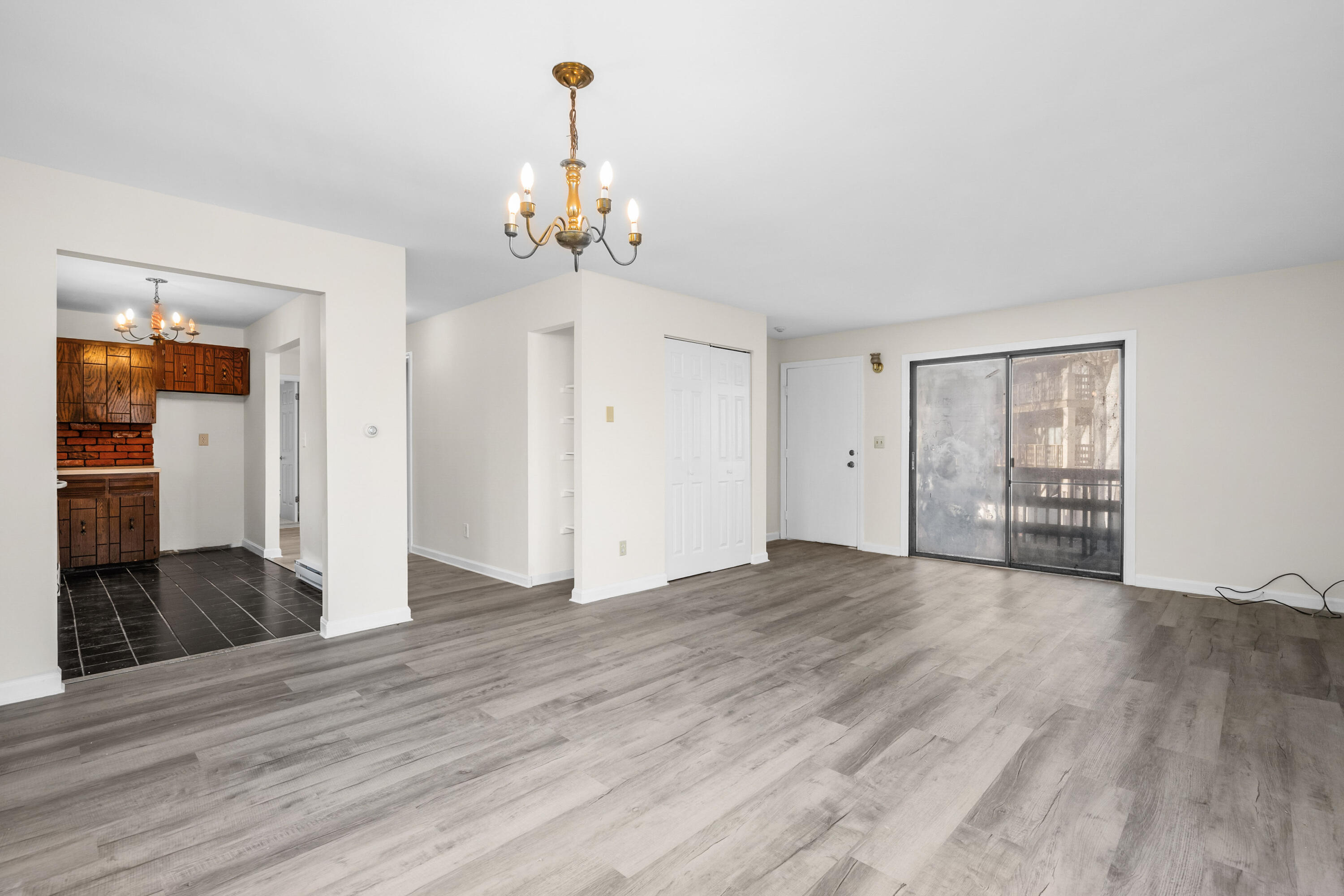 800 Bearses Way, Unit 2NB Hyannis, MA 02601 - Photo 9 of 20 a view of livingroom with hardwood floor and kitchen view