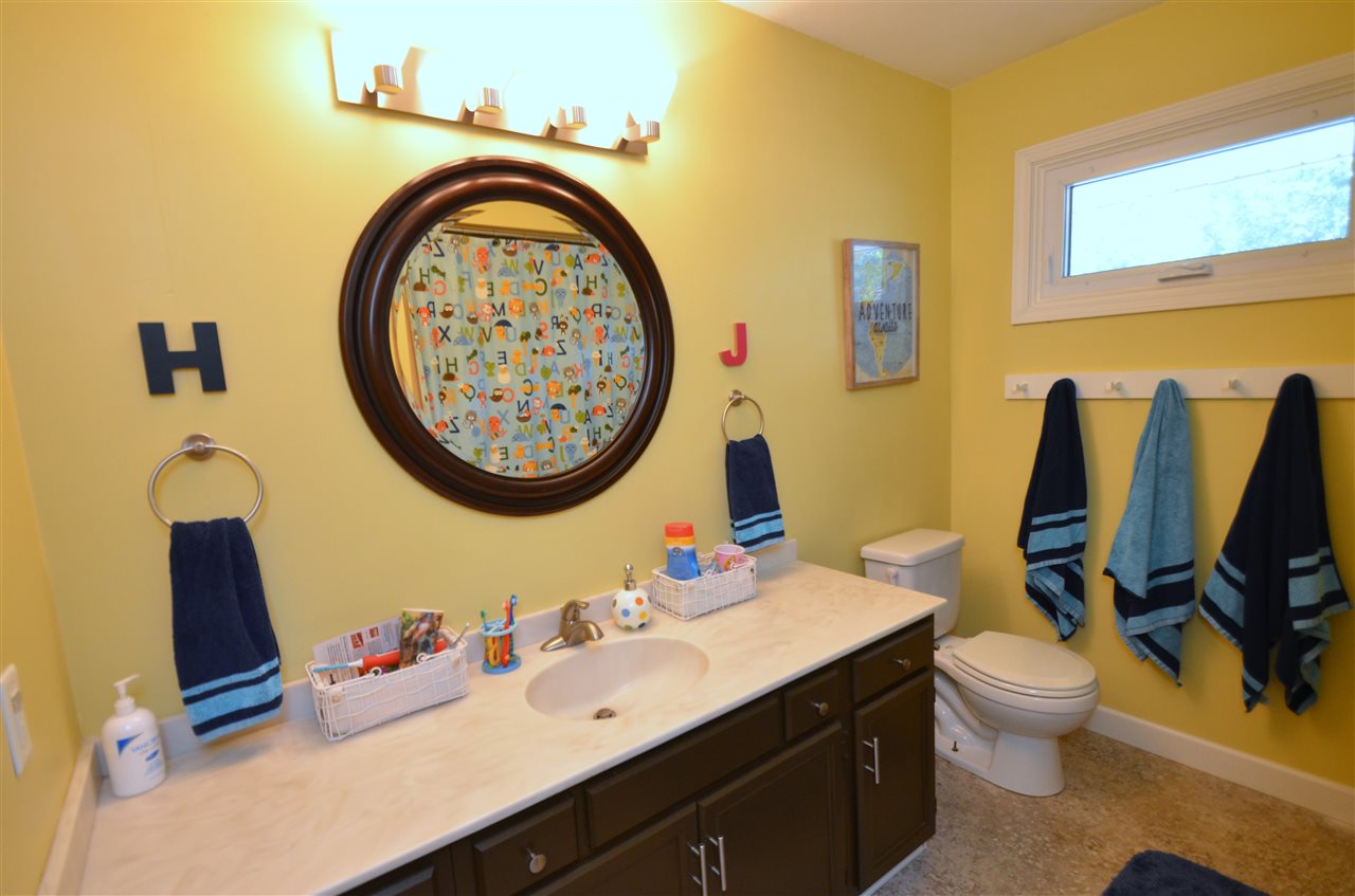 3942 Valerie Road Roscoe, IL 61073 - Photo 14 of 25 a bathroom with a toilet sink and mirror