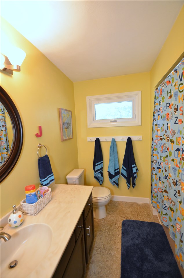 3942 Valerie Road Roscoe, IL 61073 - Photo 15 of 25 a bathroom with a sink and a mirror