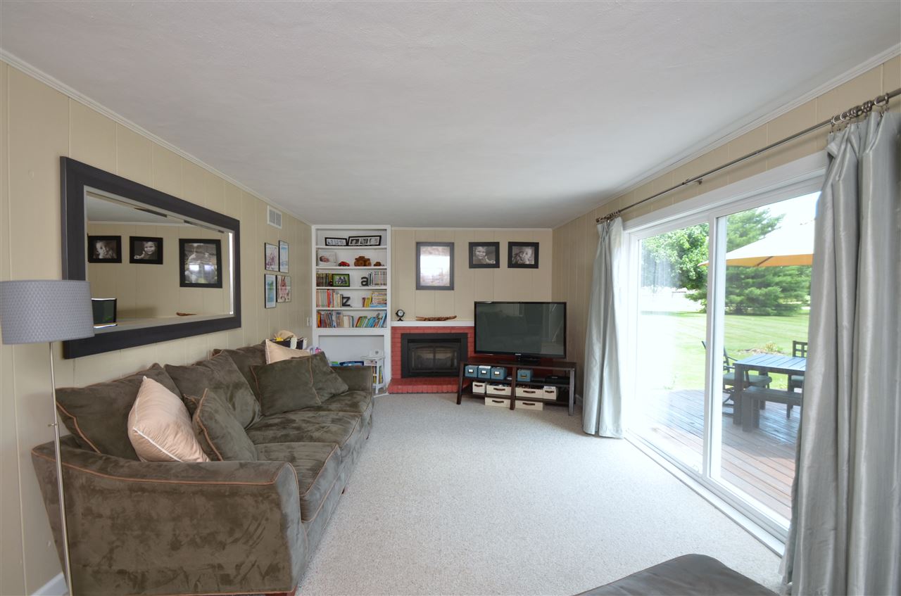 3942 Valerie Road Roscoe, IL 61073 - Photo 17 of 25 a living room with furniture and a flat screen tv