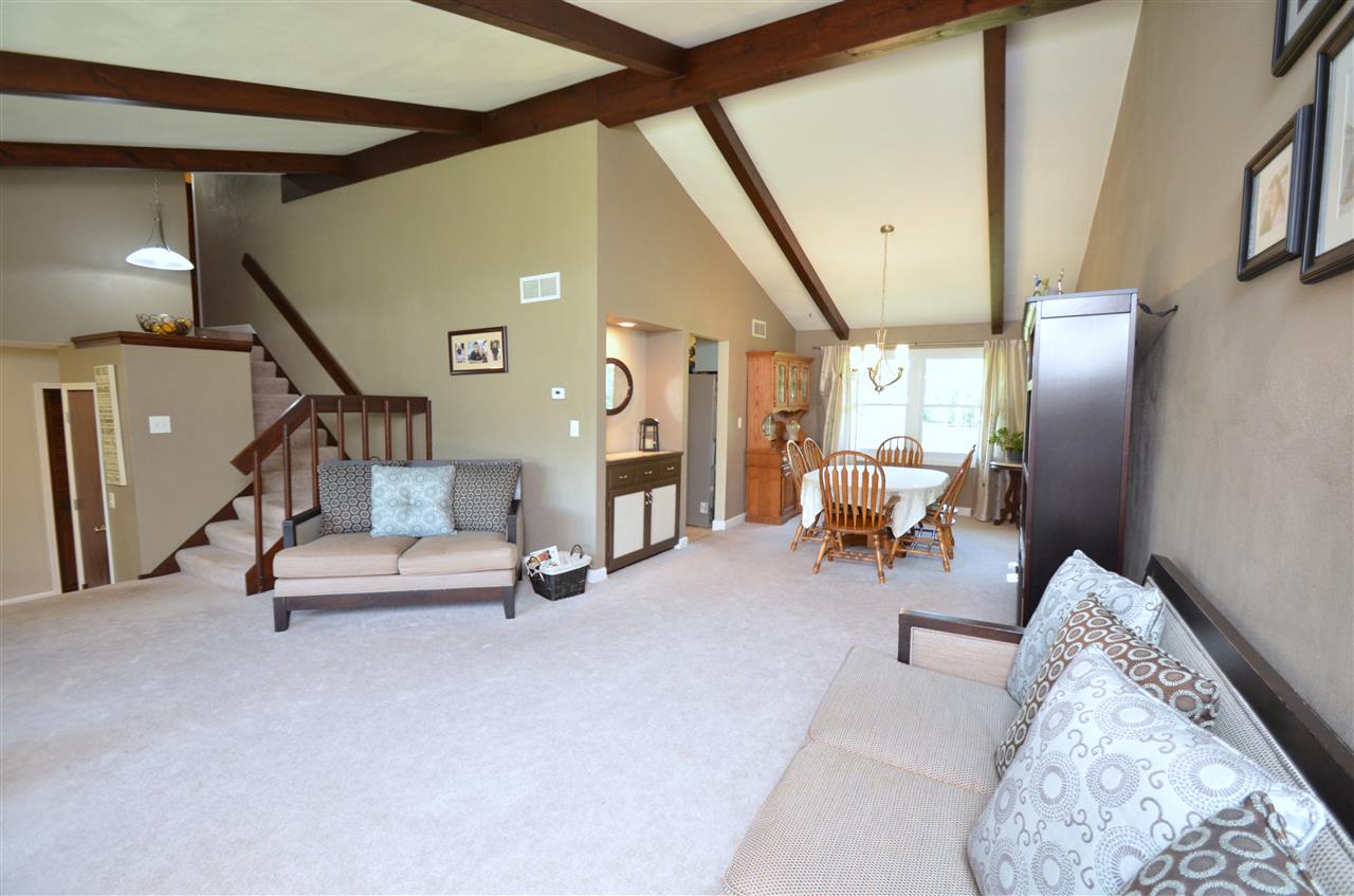 3942 Valerie Road Roscoe, IL 61073 - Photo 3 of 25 a living room with furniture and a painting