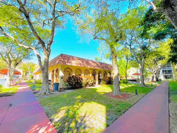 a living room with table and chairs