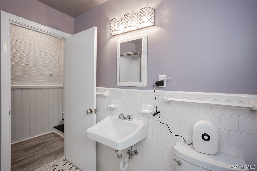 3160 Mountclair Road Chester, VA 23831 - Photo 19 of 50 a bathroom with a sink a toilet and shower