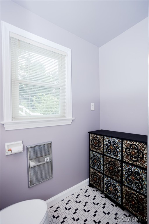 3160 Mountclair Road Chester, VA 23831 - Photo 21 of 50 a bathroom with a toilet a sink and a window