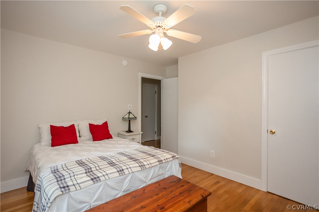3160 Mountclair Road Chester, VA 23831 - Photo 23 of 50 a bedroom with a bed and a chandelier