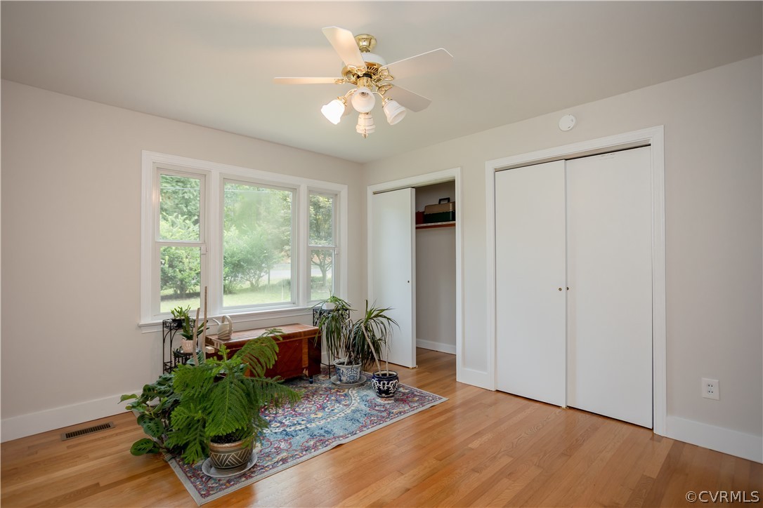 3160 Mountclair Road Chester, VA 23831 - Photo 29 of 50 a living room with hardwood floor and a ceiling fan