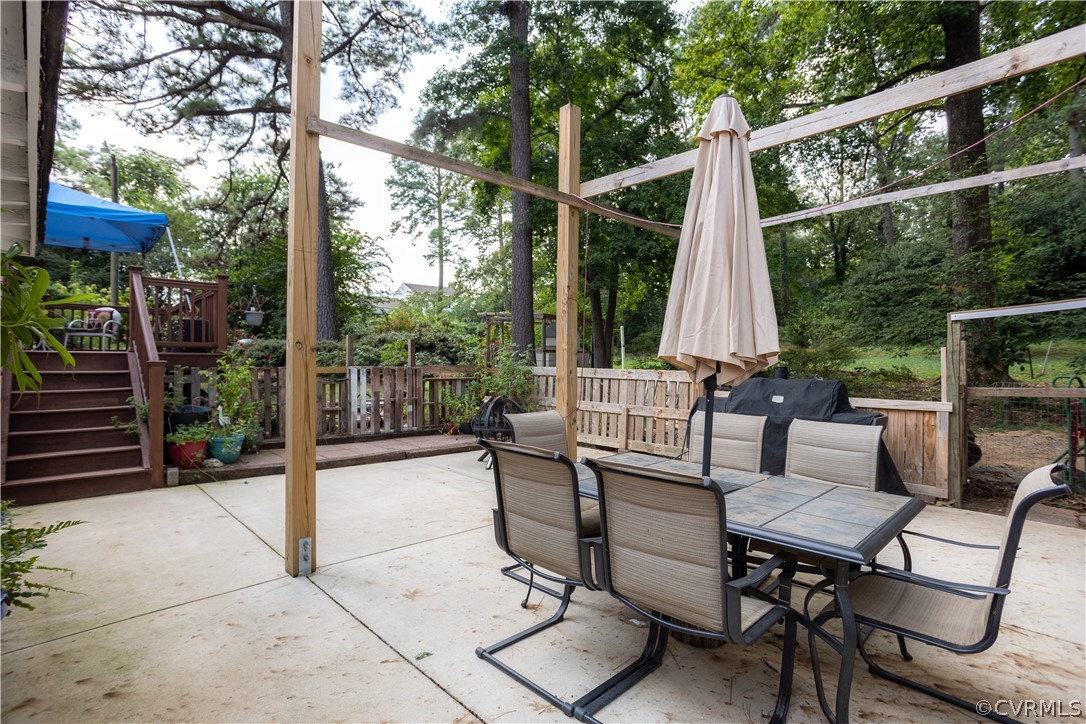 3160 Mountclair Road Chester, VA 23831 - Photo 36 of 50 a view of a patio with a dining table and chairs
