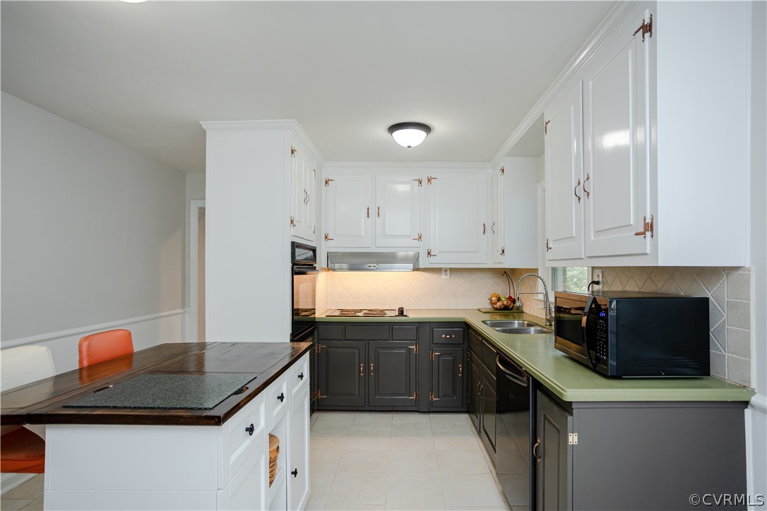 3160 Mountclair Road Chester, VA 23831 - Photo 6 of 50 a kitchen with stainless steel appliances granite countertop a sink and a stove