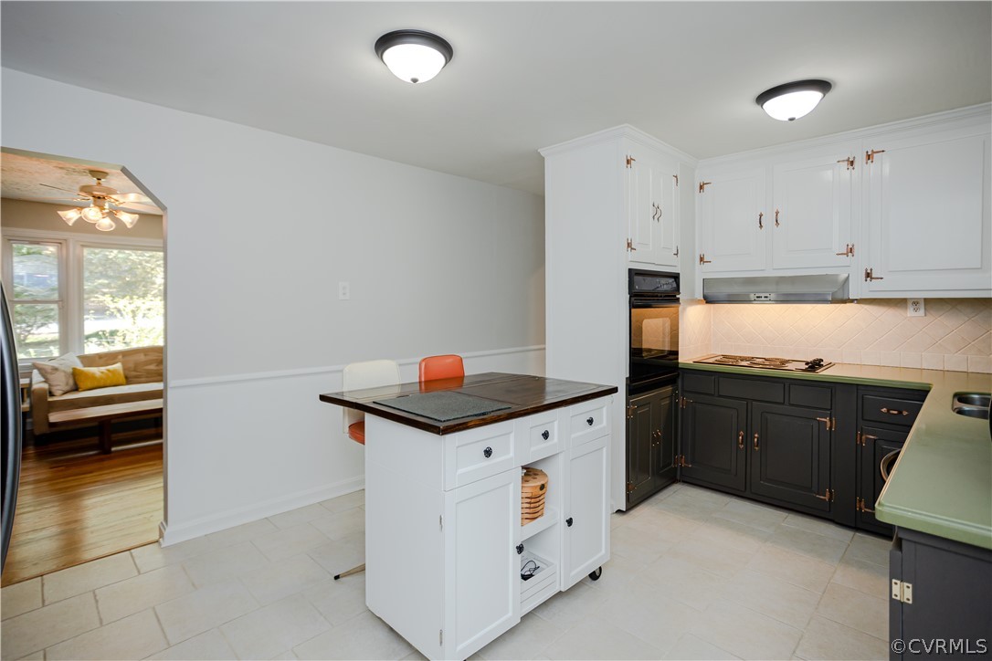3160 Mountclair Road Chester, VA 23831 - Photo 8 of 50 a kitchen with granite countertop white cabinets and white appliances