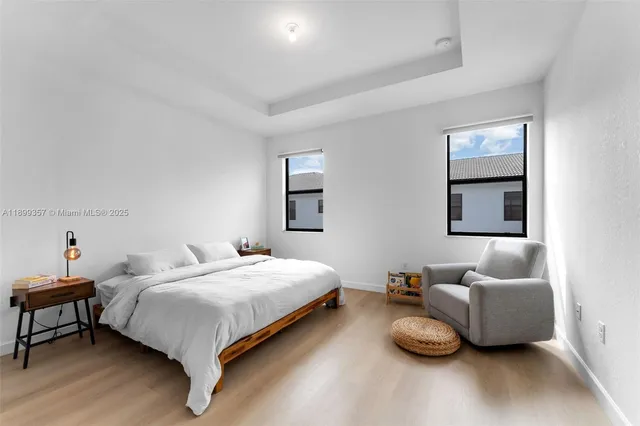 a bedroom with a bed and a couch