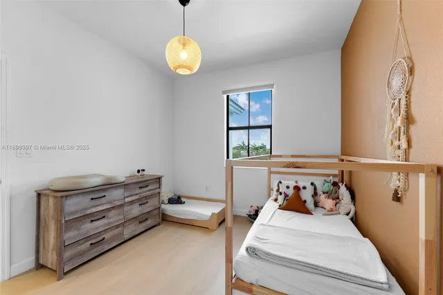 a bed room with a bed and a window