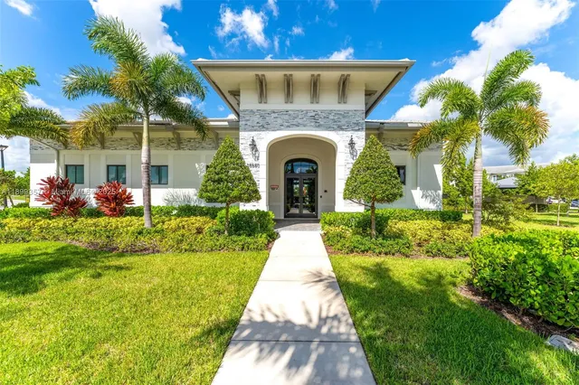 a view of a patio with table and chairs potted plants