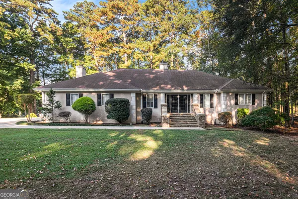 a front view of a house with a yard porch and patio